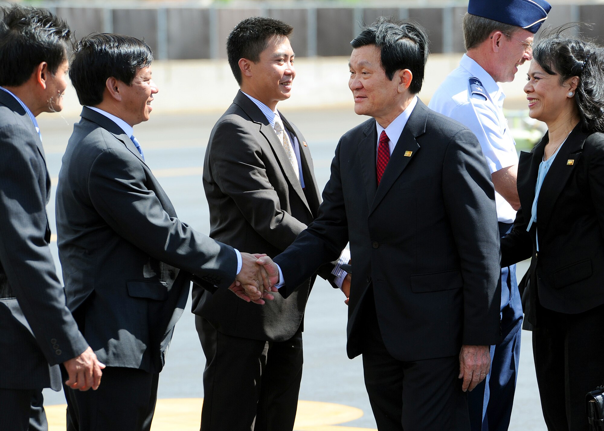 JOINT BASE PEARL HARBOR-HICKAM, Hawaii--Vietnam President, Truong Tan Sang and First Lady Madam Mai Thi Hanh meets with various special greeters during their arrival to Joint Base Pearl Harbor-Hickam, for the Asia-Pacific Economic Cooperation summit, Nov. 10. APEC is the premier economic forum in the Asia-Pacific region.  Established in 1989 and comprising 21 member economies from around the Pacific Rim, including the U.S., APEC fosters growth and prosperity by facilitating economic cooperation and expanding trade and investment throughout the region. (U.S. Air Force photo/Tech. Sgt. Jerome S. Tayborn)  