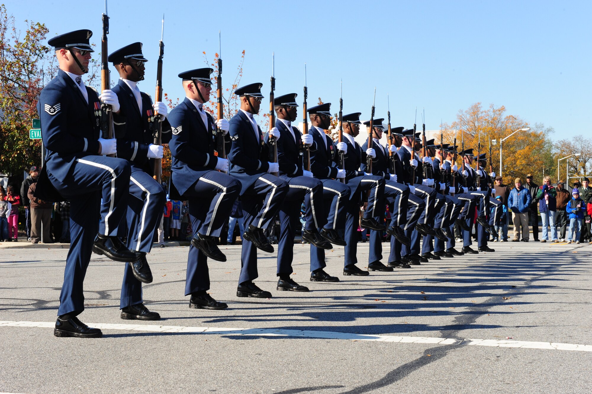 The U.S. Air Force Honor Guard Drill Team performs near the Town Commons at the Greenville, N.C. Veterans Day ceremony, Nov. 11, 2011.  In their 60-year history, the Honor Guard Drill Team has performed in all 50 states and numerous foreign countries.  Drill team members undergo a four to six week intense training course to ensure all members gain and maintain the cutting edge of precision needed to complete their complex routines.  (U.S. Air Force photo/Capt. Matt Schroff)