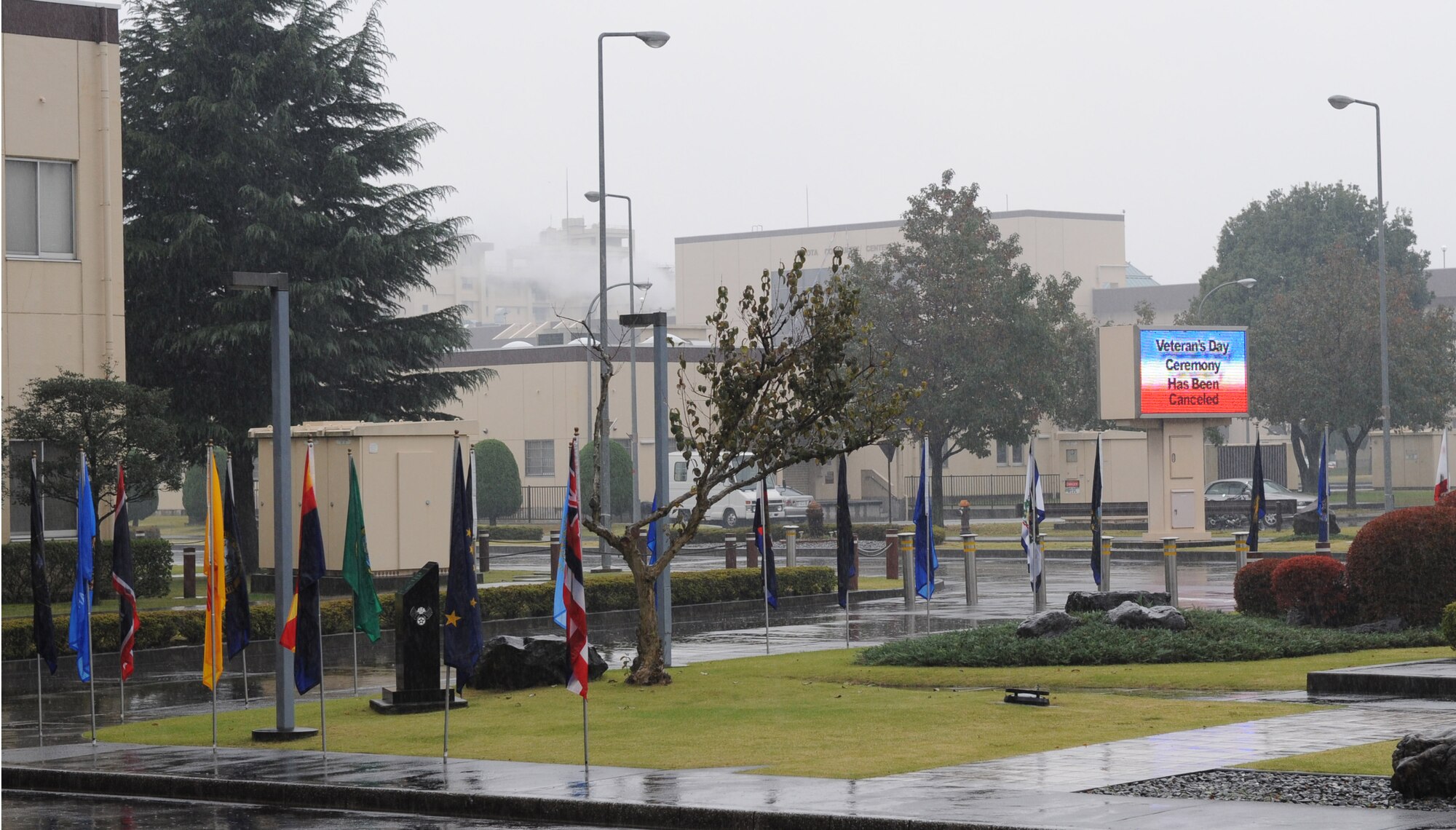 YOKOTA AIR BASE, Japan -- Rain falls outside the 374th Airlift Wing headquarters’ building here on Veteran’s Day, November 11, 2011. Bad weather forced base leadership to cancel the outdoor ceremony, but Yokota scouts chose to show up despite the weather. (U.S. Air Force photo/Capt. Raymond Geoffroy)