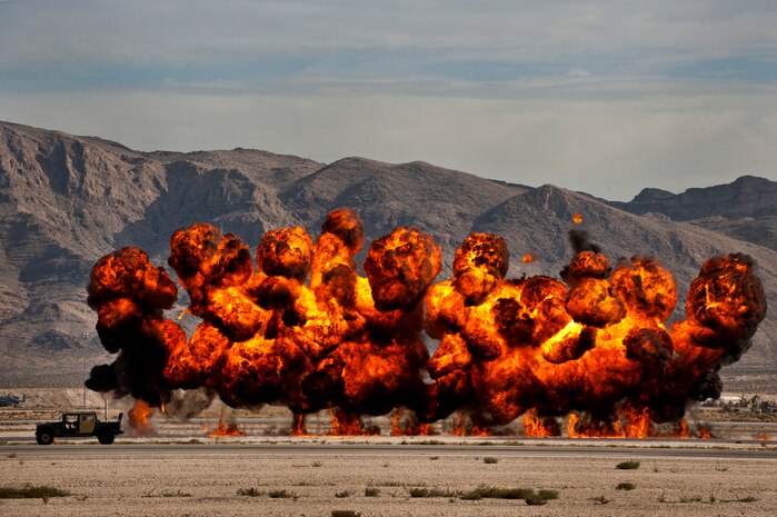 U.S. Air Force Joint Terminal Attack Controllers demonstrate their capabilities by calling in simulated air strikes during the 2011 Aviation Nation Open House Nov. 13, at Nellis Air Force Base, Nev. Aviation Nation celebrates 70 years of airpower in Las Vegas and the Air Force's accomplishments in air, space and cyberspace. (U.S. Air Force photo by Airman 1st Class George Goslin/Released)