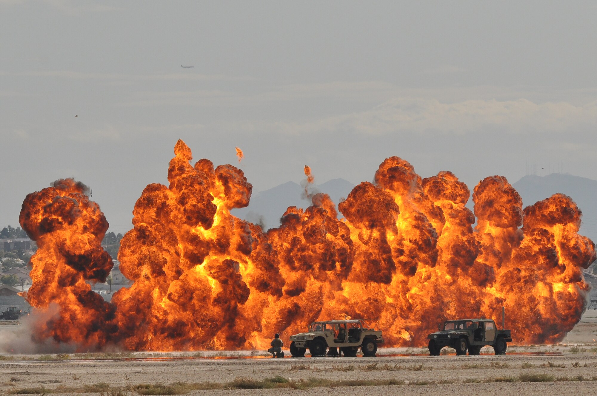 U.S. Air Force pararescueman respond to a simulated attack during the 2011 Aviation Nation Open House Nov. 12th, at Nellis Air Force Base, Nev.  Aviation Nation celebrates 70 years of airpower in Las Vegas and the Air Force's accomplishments in air, space and cyberspace. (U.S. Air Force photo by Tech. Sgt. Bob Sommer/Released)