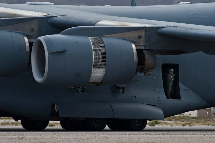 A U.S. Air Force loadmaster looks out of a C-17 Globemaster III from March AFB after landing during the 2011 Aviation Nation Open House Nov. 13, at Nellis Air Force Base, Nev. Aviation Nation celebrates 70 years of airpower in Las Vegas and the Air Force's accomplishments in air, space and cyberspace. (U.S. Air Force photo by Senior Airman Brett Clashman/Released)
