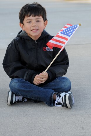 A young boy watches the United States Air Force Air Demonstration Squadron Thunderbirds, perform during the 2011 Aviation Nation Nov. 12th, at Nellis Air Force Base, Nev. The Nellis Open House is an opportunity for the Las Vegas community to view aerial demonstrations and static displays of various aircraft from the military. The open house also acts as the final air show of the year for the Thunderbirds.  (U.S. Air Force photo by Staff Sgt. Taylor Worley/Released)