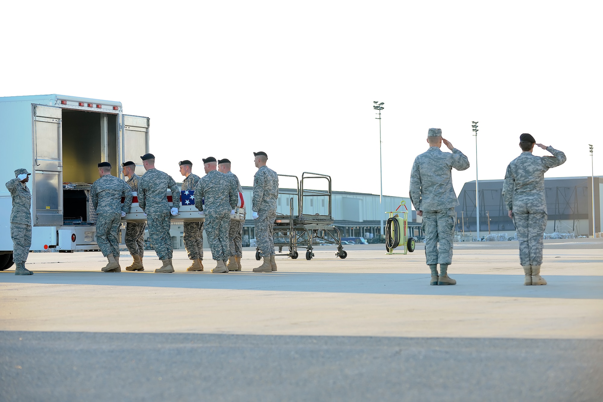 A U.S. Army carry team transfers the remains of Army Pfc. Cody R. Norris of Houston Texas,, at Dover Air Force Base, Del., Nov. 12, 2011. Norris was assigned to the 2nd Battalion, 34th Armor Regiment, 1st Heavy Brigade Combat Team, 1st Infanrty Division, Fort Riley, Kan. (U.S. Air Force photo/Adrian R. Rowan)
