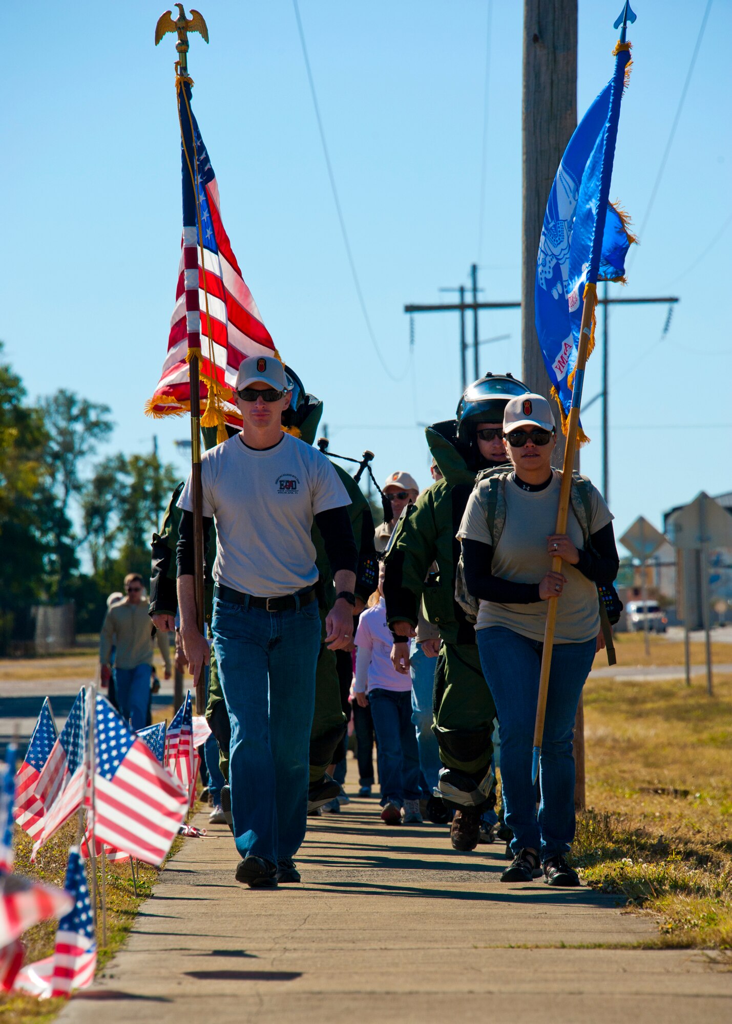 Members of the Army Explosive Ordnance Disposal Training Detachment begin the Veteran's Day Walk Nov. 11 at Eglin Air Force Base, Fla.  Army EOD techs took turns walking from Eglin to the EOD Memorial in the 79-pound bomb suit in two-person teams.  The detachment commander and sergeant major walked the first mile.  (U.S. Air Force photo/Samuel King Jr.) 