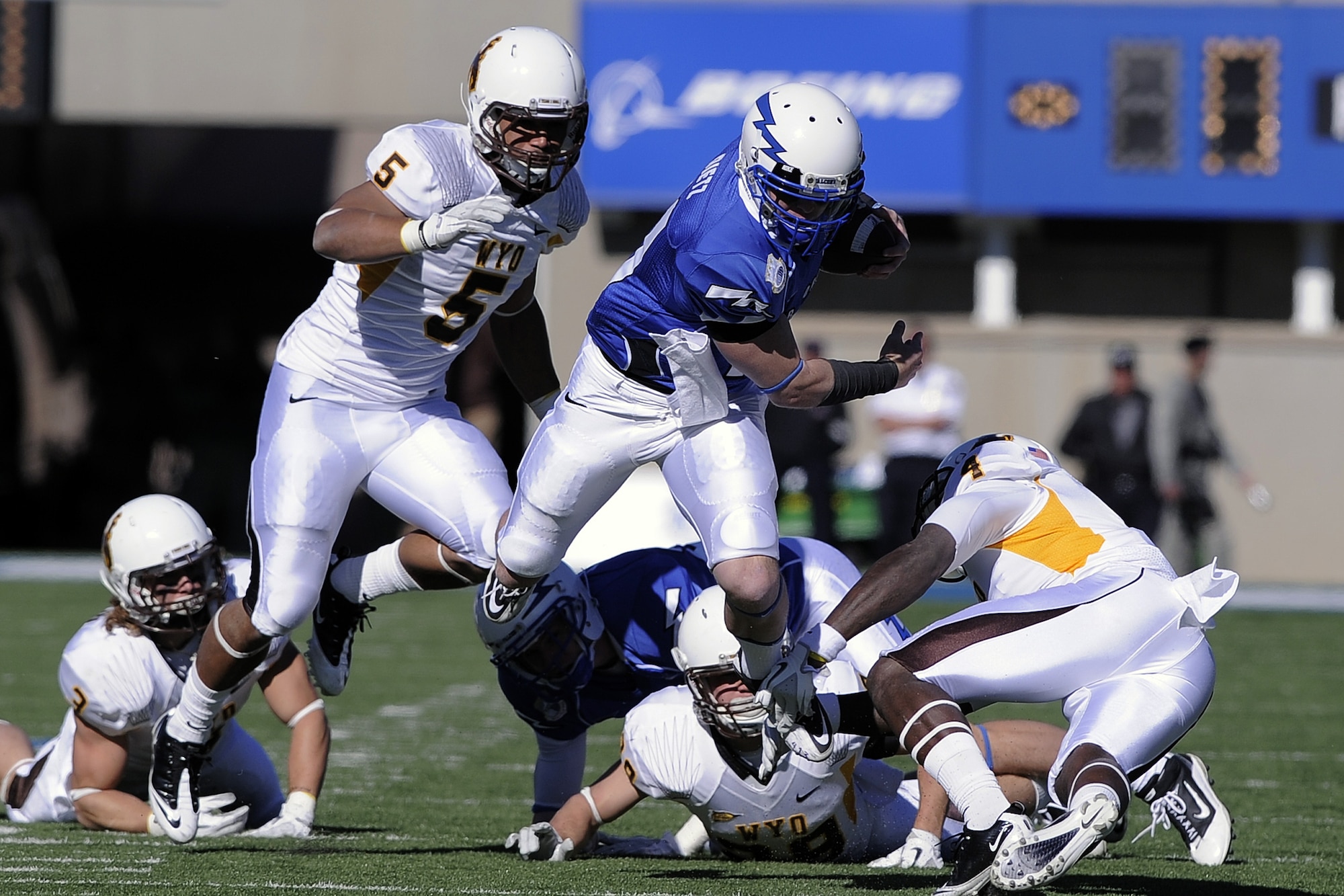 Senior quarterback Connor Deitz fights for yardage against the Wyoming Cowboys at Falcon Stadium Nov. 12, 2011, in Colorado Springs, Colo. The Cowboys defeated Air Force 25-17. (U.S. Air Force photo/Mike Kaplan)
