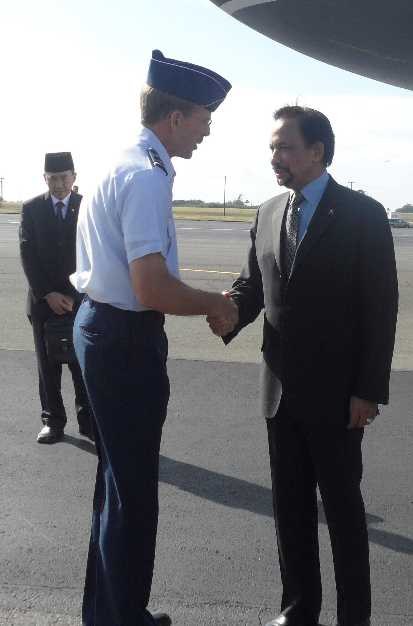 Maj. Gen. Jon Shasteen, mobilization assistant to the Commander, Pacific Air Forces, greets the leader of Brunei, Sultan Sir Bolkiah Hassanal, during his arrival to Joint Base Pearl Harbor-Hickam, for the Asia-Pacific Economic Cooperation summit, Nov. 11.  President Obama chose his birthplace of Honolulu as the site for APEC 2011 to highlight America's position as a Pacific nation. (U.S. Air Force photo/Maj. Alysia Harvey)