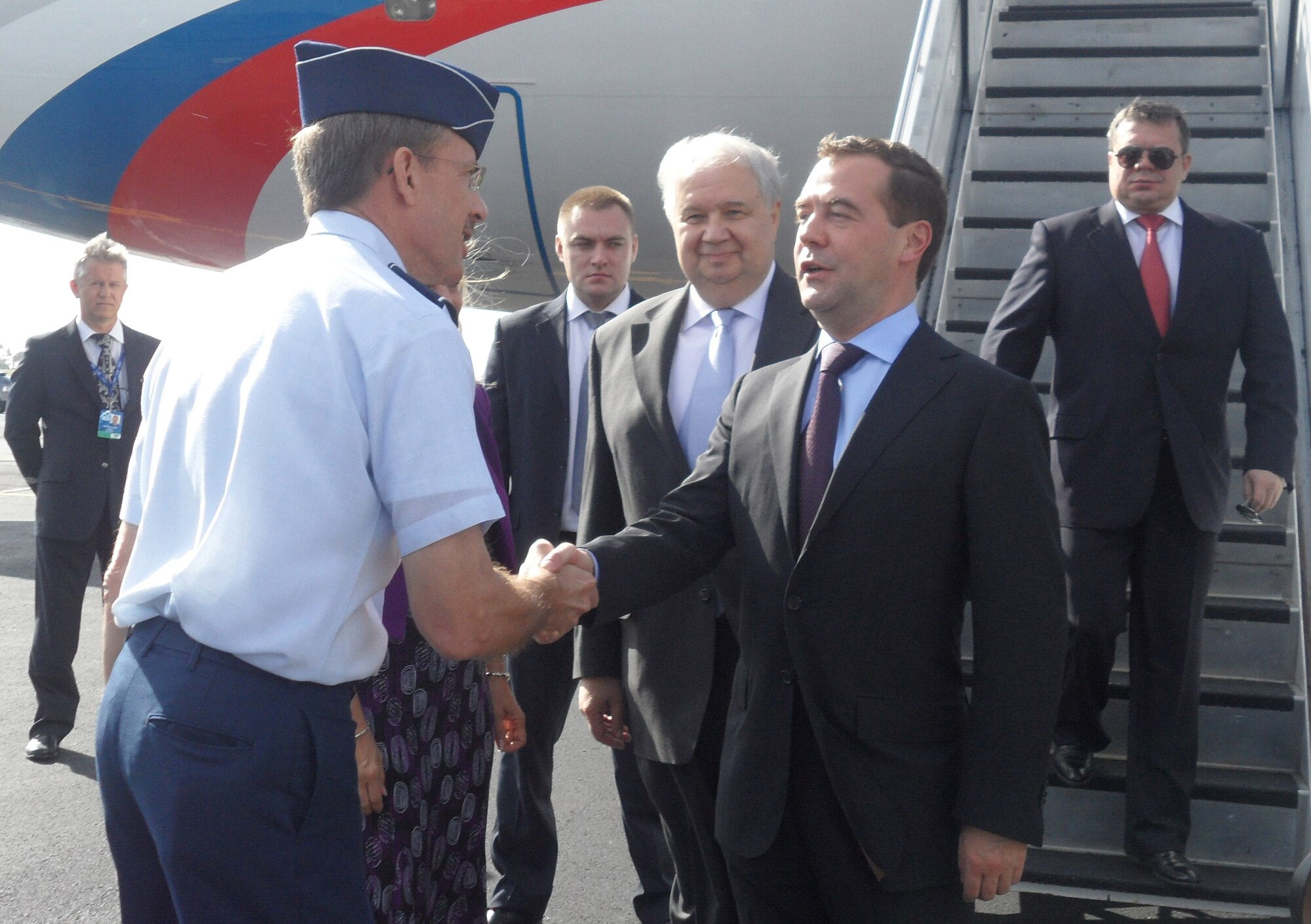 Russian President Dmitry Medvedev and his delegation are welcomed by Maj. Gen. Jon Shasteen, mobilization assistant to the Commander, Pacific Air Forces, to Joint Base Pearl Harbor-Hickam, for the Asia-Pacific Economic Cooperation summit, Nov. 11.  As host of APEC 2011, the United States aims to create opportunities for prosperity and job creation by expanding trade and investment, cultivating small and medium-sized businesses, and fostering an environment that allows innovation to flourish. (U.S. Air Force photo/Maj. Alysia Harvey)
