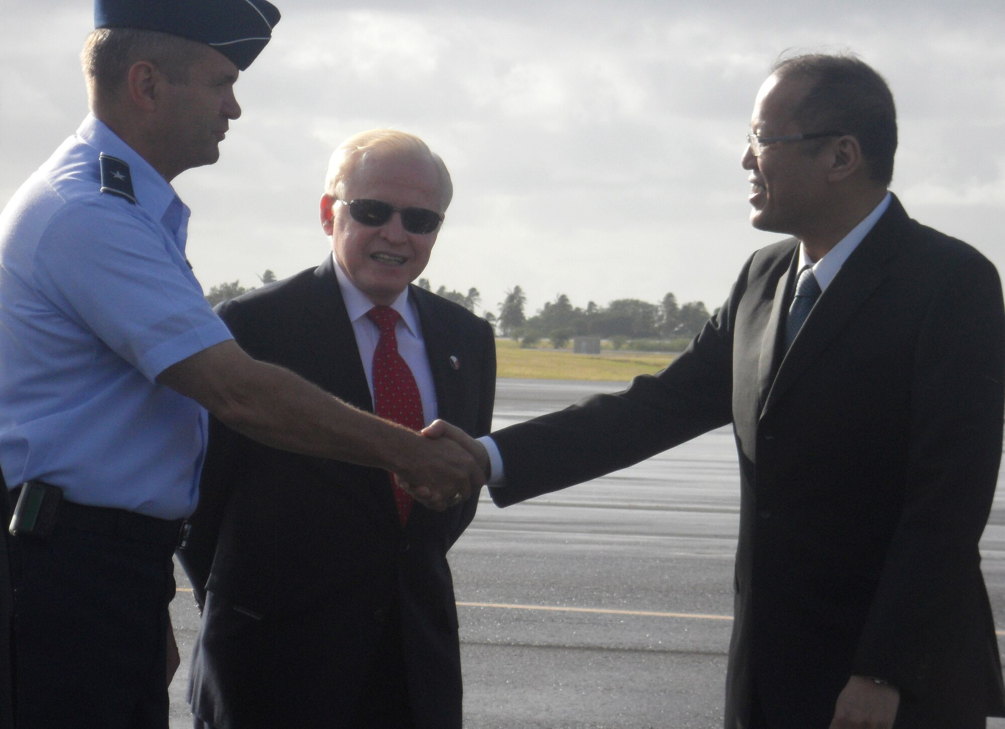 Brig. Gen. Scott West, Headquarters Pacific Air Forces Deputy Director of Operations, Plans, Requirements and Programs, welcomes the President of the Philippines, Benigno Aquino III, to Joint Base Pearl Harbor-Hickam, for the Asia-Pacific Economic Cooperation summit, Nov. 11.  APEC fosters growth and prosperity by facilitating economic cooperation and expanding trade and investment throughout the region. (U.S. Air Force photo/Maj. Alysia Harvey)