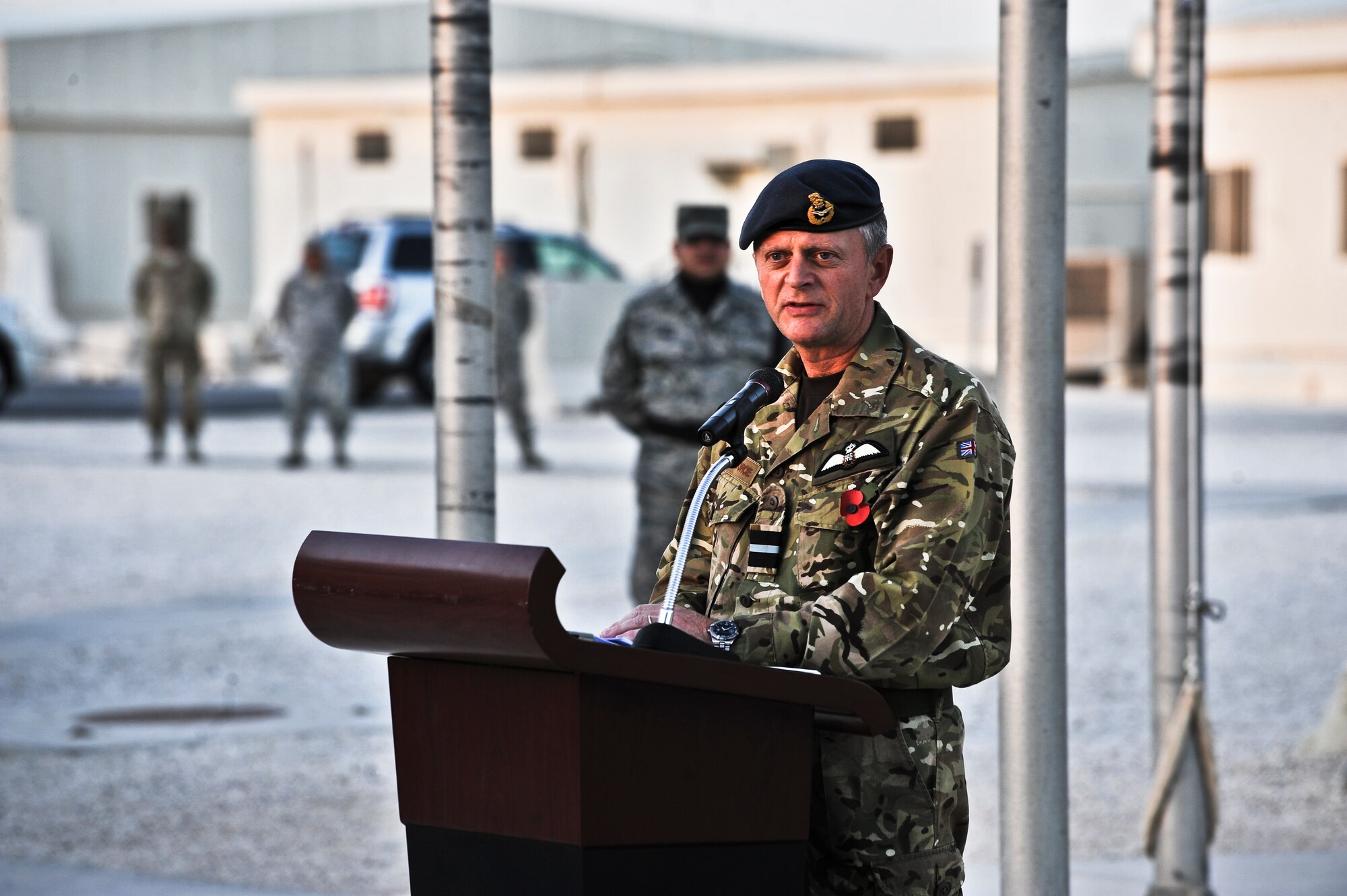 Air Commodore Ashley Stevenson, Air Officer Commanding 83 Expeditionary Air Group and United Kingdom Air Component Commander, addresses attendees of a Veterans Day ceremony Nov. 11, 2011, at an undisclosed location in Southwest Asia. Stevenson is permanently assigned to the 83 EAG. (U.S. Air Force photo/Senior Airman Paul Labbe)