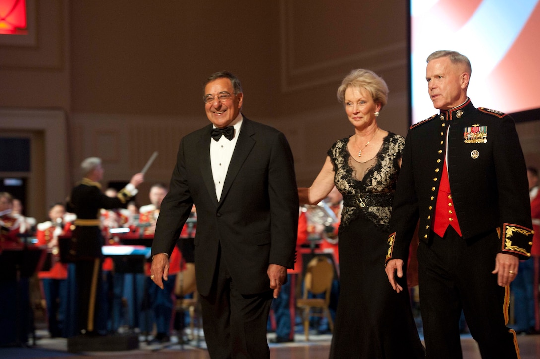 Marine Corps Commandant Gen. James F. Amos, right, and his wife, Bonnie, escort Defense Secretary Leon E. Panetta during the Commandant's Marine Corps Ball in National Harbor, Md., Nov. 12, 2011. 