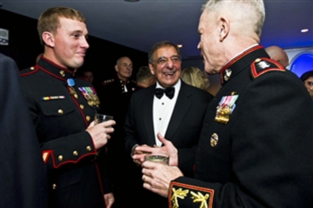 Defense Secretary Leon E. Panetta and Gen. James F. Amos, commandant of the Marine Corps, speak with Marine Corps Sgt. Dakota L. Meyer during the Commandant's Marine Corps Ball in National Harbor, Md., Nov. 12, 2011. Meyer is the most recent Marine Corps recipient of the Medal of Honor.