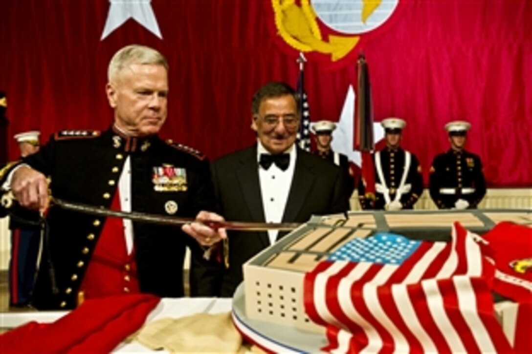 Defense Secretary Leon E. Panetta watches as Marine Corps Gen. James F. Amos, commandant of the Marine Corps, cuts the birthday cake during the Commandant's Marine Corps Ball in National Harbor, Md., Nov. 12, 2011.  Panetta helped celebrate the 236th birthday of the Marine Corps with more than 3,000 active duty and retired Marines and their families.