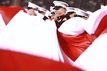 EAST RUTHERFORD, N.J. -- Marines wave back to a cheering crowd after a pregame ceremony before the  the New York Jets vs New England Patriots game, Nov. 13. The West Point Band performed at half time and 100 service members presented the large flag during the National Anthem. (Official Marine Corps photo by Cpl. Caleb Gomez / RELEASED)