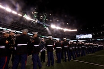 EAST RUTHERFORD, N.J. -- Marines, Sailors, Coast Guardsmen, Airmen and Soldiers unfurled an American Flag across the field during a pre-game ceremony before the New York Jets vs New England Patriots game, Nov. 13. The West Point Band performed at half time and 100 service members presented the large flag during the National Anthem. (Official Marine Corps photo by Sgt. Randall A. Clinton / RELEASED)