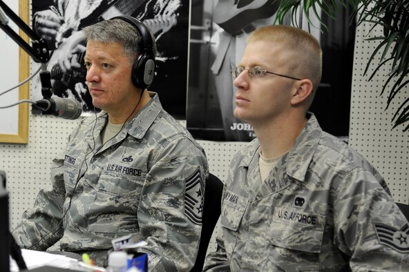 MISAWA AIR BASE, Japan -- Chief Master Sgt. Russell Hastings, left, 35th Fighter Wing command chief, and Staff Sgt. Scott Wyman, 35th Logistics Readiness Squadron, listen to topics of discussion during the Commanders Open Line radio show here Oct. 28. Sergeant Wyman is the first junior enlisted member selected by the Focus 5/6 organization to shadow Chief Hastings during a 3-day mentorship program. The program gives a junior enlisted member the opportunity to shadow the command chief to various meetings, luncheons, briefings and anything else the chief may have on his calendar. (U.S. Air Force photo/Tech. Sgt. Marie Brown)
