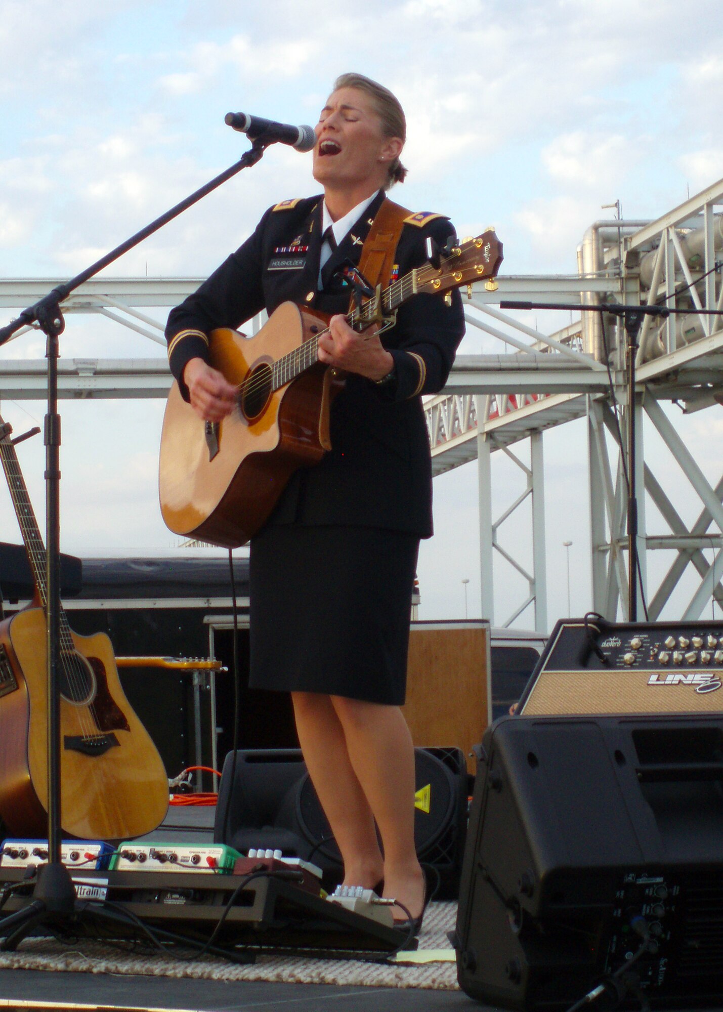 Maj. Jennifer Housholder, U.S. Army,  performs at the American Airlines center in Fort Worth Oct. 22.  Housholder joined Clint Black, Gary Sinise, and other entertainment headlines in raising more than $1 million to support military members and their families during Sky Ball IX. (Courtesy photo)