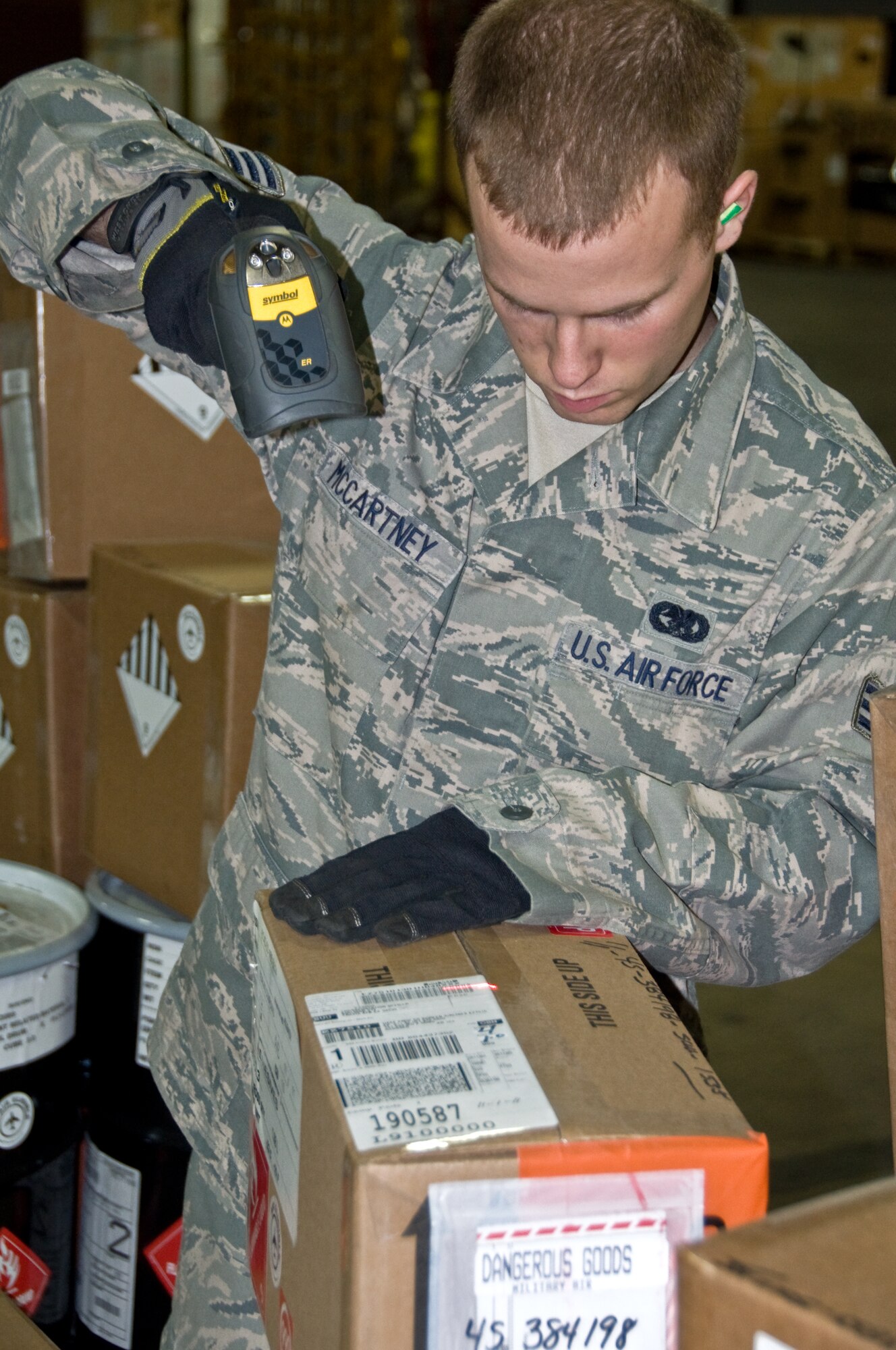 Senior Airman Michael McCartney, 60th Aerial Port Squadron cargo in-check technician, performs a basic in-check Tuesday. The 60th APS receives between 60 and 80 tractor trailer trucks daily and all cargo must be broken down and manually in-checked. (U.S. Air Force photo/Airman 1st Class Joshua Crane)
