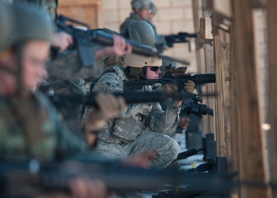 HOLLOMAN AIR FORCE BASE, N.M. -- U.S. Air Force Airman 1st Class Ryan Likout, 49th Civil Engineer Squadron Explosive Ordinance Disposal technician, keeps his sights on his target Nov. 8, 2011, during close-range combat training at the Combat Arms Training and Maintenance (CATM) range. In addition to basic rifle marksmanship training, close-range combat training requires Airmen to shoot targets at 7, 15 and 25 meters with a combination of multiple target drills, threat discrimination and burst fire. (U.S. Air Force photo by Senior Airman Veronica Stamps/Released)