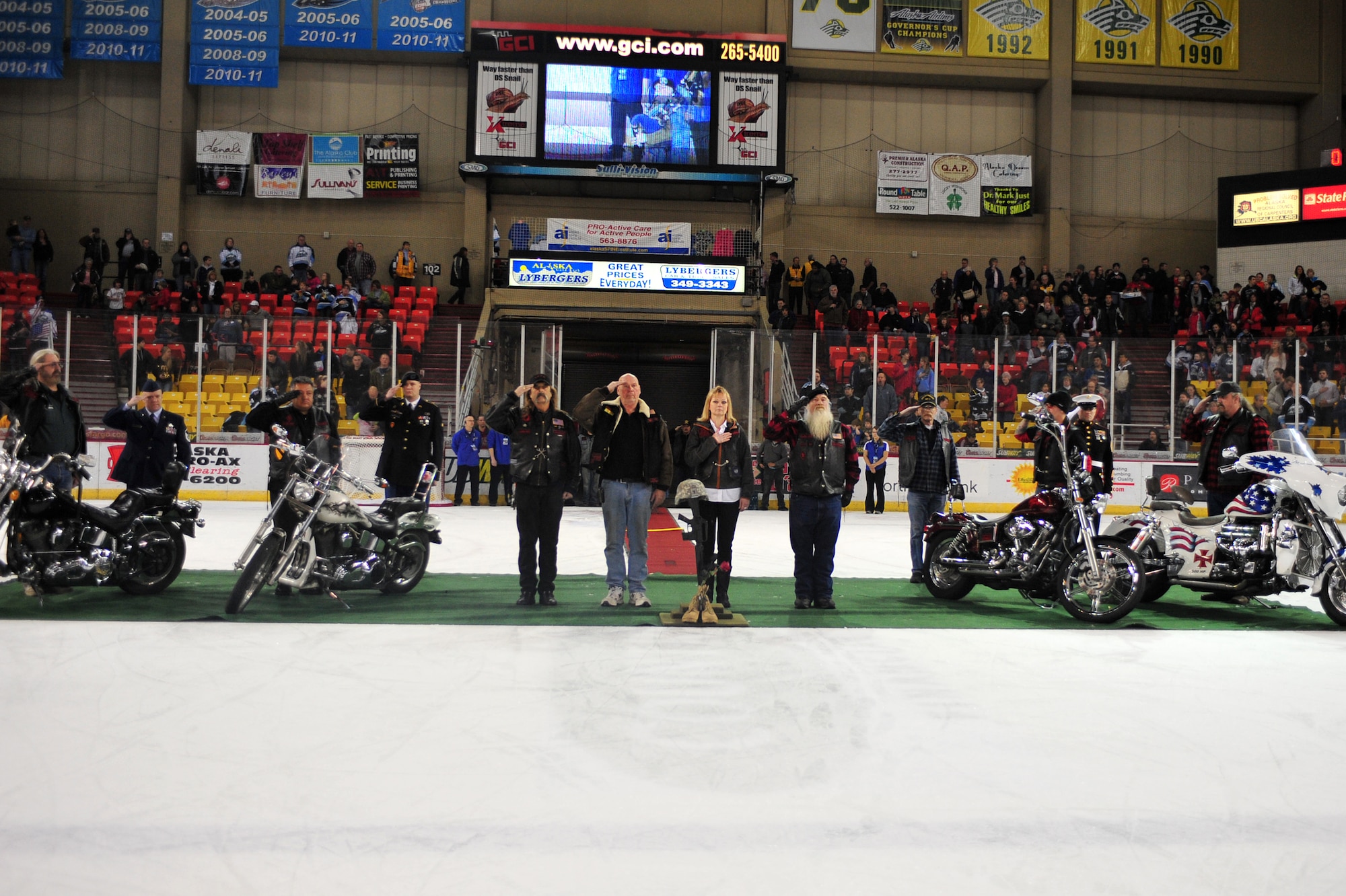 The Alaska Veterans Motorcycle Club and each branch active duty Purple Heart Recipients pay tribute to fallen warriors during an Alaska Aces game in Sullivan Arena, Anchorage, Alaska, Nov. 11. The Alaska Aces honored veterans for their service with a military appreciation weekend. (U.S. Air Force photo/Staff Sgt. Sheila deVera)