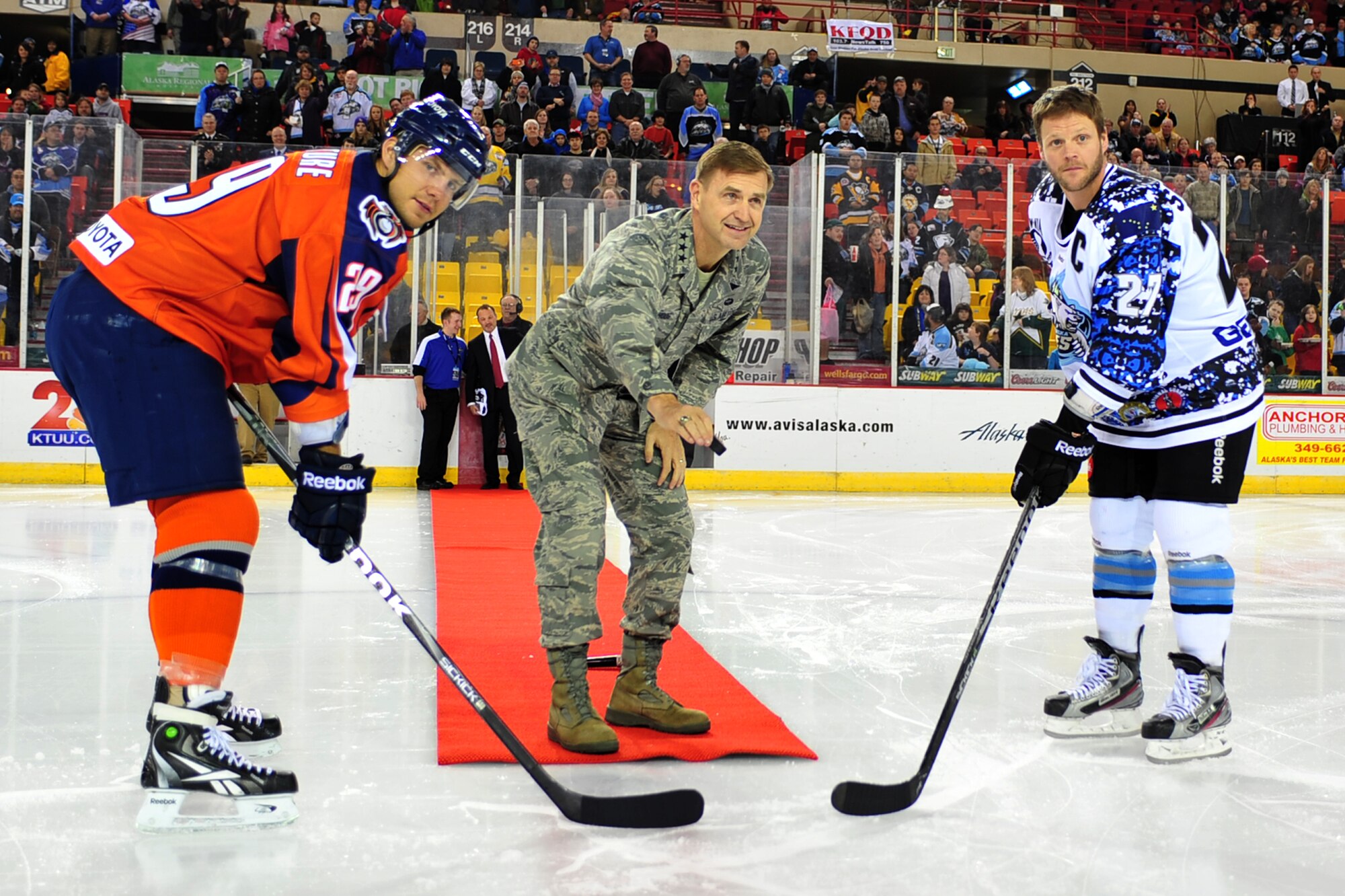 Lt. Gen. Stephen Hoog, Alaskan Command and 11th Air Force commander, drops the puck before the Alaska Aces game in Sullivan Arena, Anchorage, Alaska, Nov. 11. The Alaska Aces honored veterans for their service with a military appreciation weekend.  (U.S. Air Force photo/Staff Sgt. Sheila deVera)