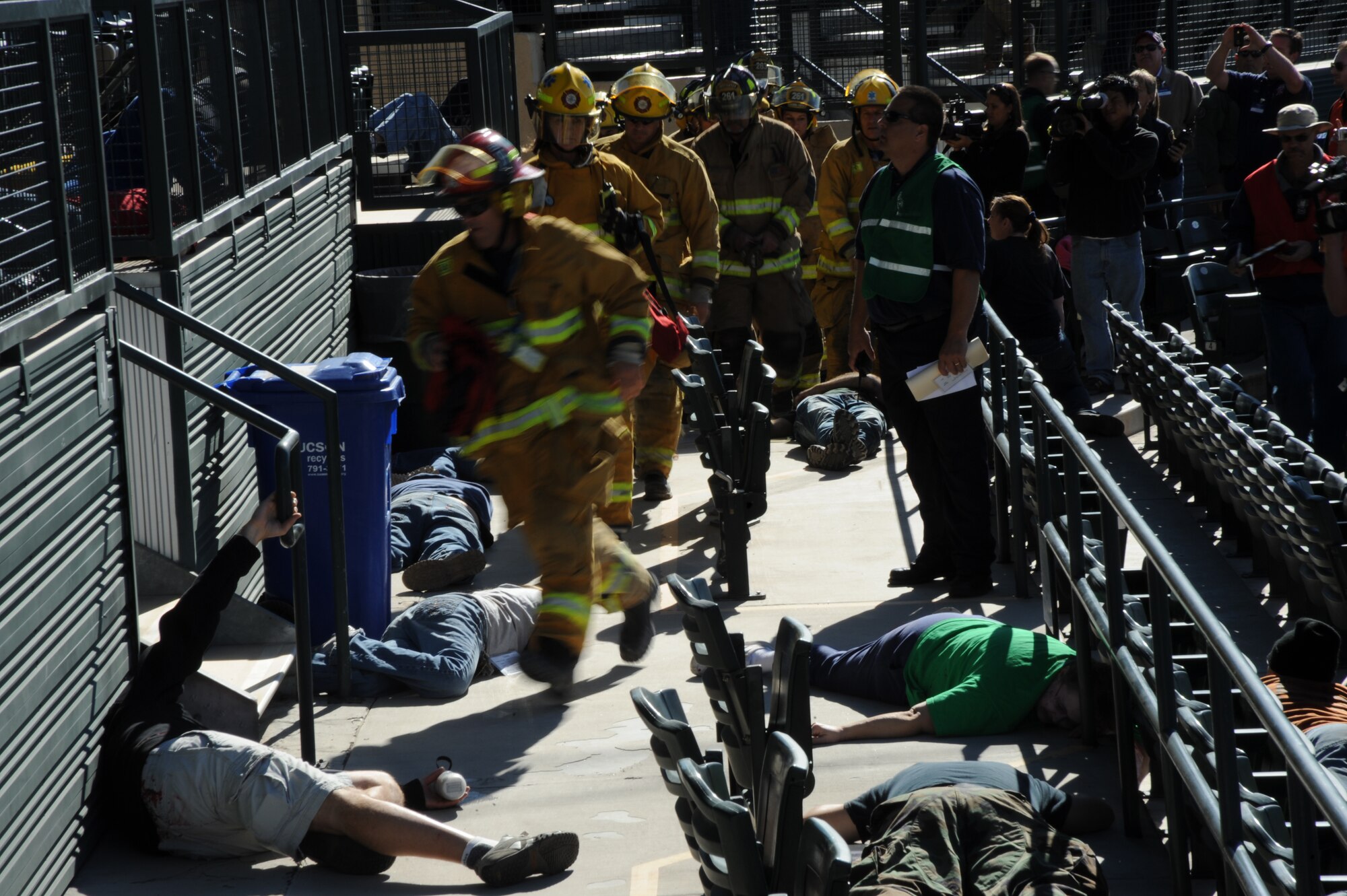Local emergency response agencies arrive on scene and begin medical triage at the Tucson Metropolitan Medical Response Systems exercise held in Tucson, Ariz., Nov. 10, 2011. Organizations from Tucson and surrounding areas participated as players in the medical exercise. Metropolitan Medial Response System exercises enable local agencies to practice responding to public health emergencies that create mass casualties. (U.S. Air Force photo by Airman 1st Class Saphfire Cook/Released)