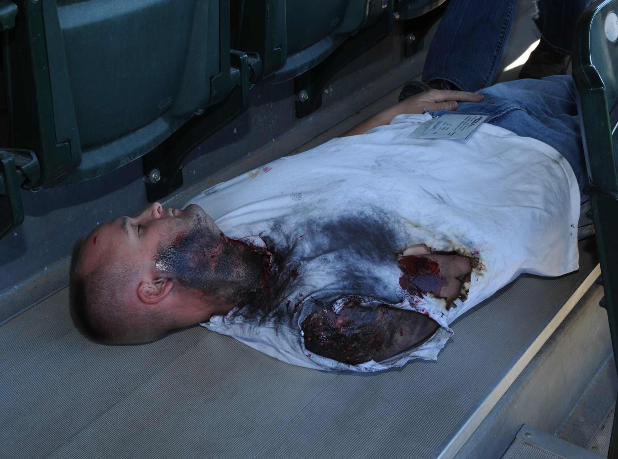 U.S. Air Force Staff Sgt. Matthew Larson, 355th Security Forces Squadron, lies in position as a simulated mass casualty victim during the Tucson Metropolitan Medical Response Systems exercise held in Tucson, Ariz., Nov. 10, 2011. Volunteers were moulaged and given a scenario to act out while medical responders attempted to perform the proper procedures. (U.S. Air Force photo by Airman 1st Class Saphfire Cook/Released)