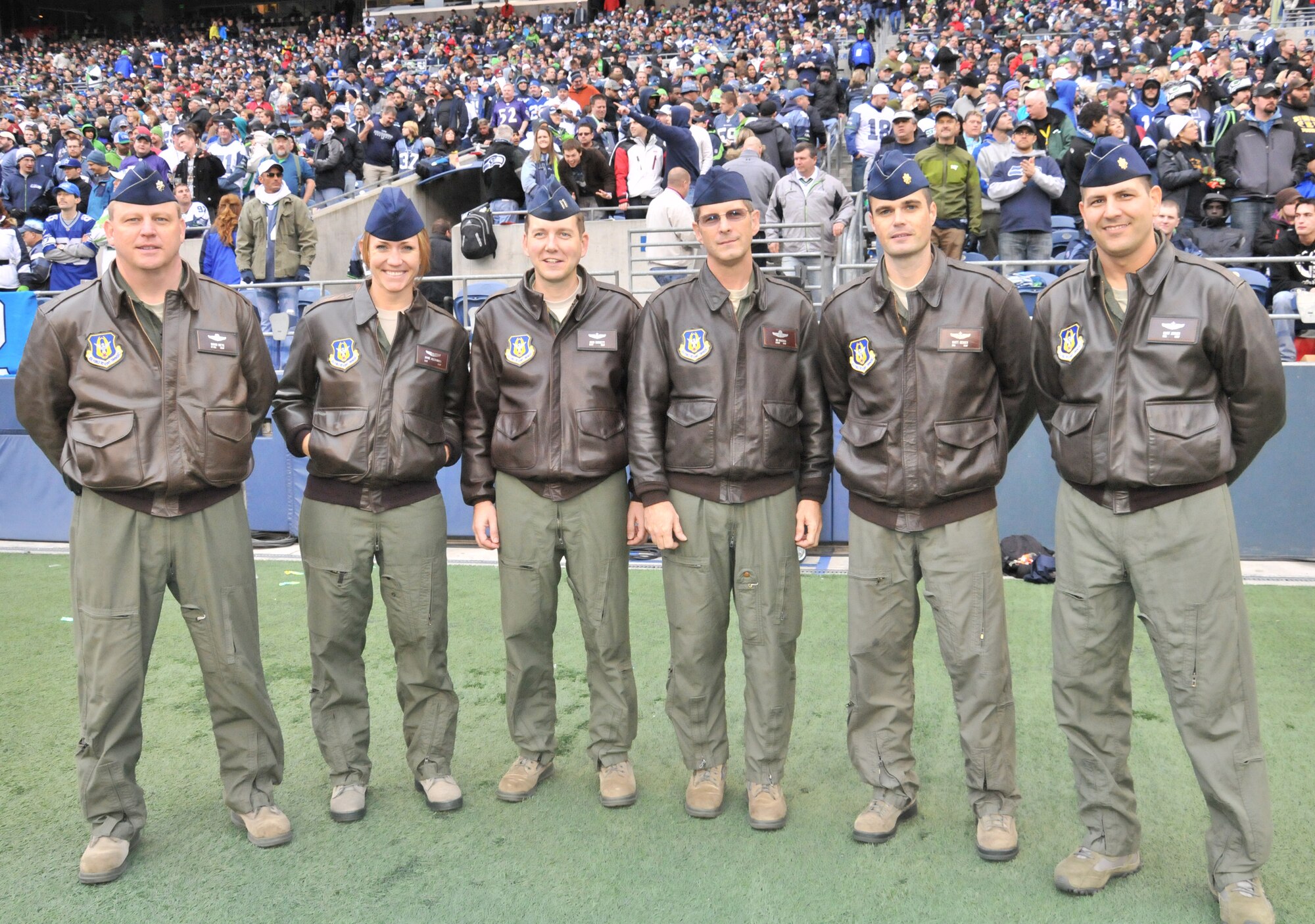 A Reserve C-17 aircrew from the 446th Airlift Wing rumbled over Century Link Stadium as part of a flyover for the Nov. 13 Seattle Seahawk's game.  From left to right, Lt. Col. Dave Mets, Staff Sgt. Jayne Alexander, Capt. John Burnett, Chief Master Sgt. James Masura, Maj. Matt Geiger, and Maj. Kurt Junker.  (U.S. Air Force photo/2nd Lt. Denise Hauser)