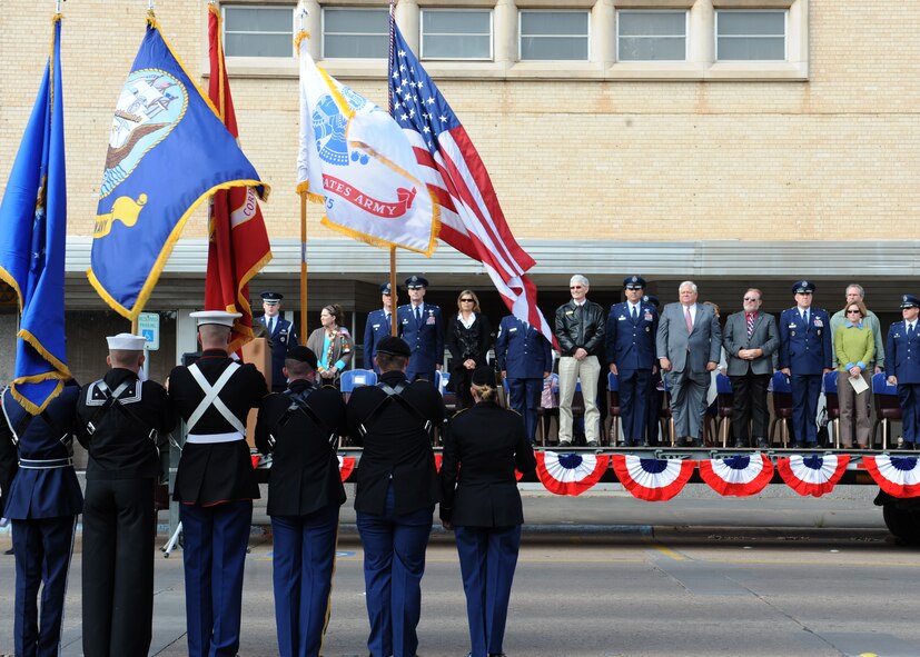 A military color guard presents the colors during the Veterans Day Parade Nov. 12, 2011, in Abilene, Texas. First proclaimed on Nov. 11, 1919, Armistice Day celebrated the signing of the Armistice that ended World War I. It was expanded in 1954 to include veterans of all wars and has been known as Veterans Day ever since. (U.S. Air Force photo by Airman 1st Class Peter Thompson/Released)