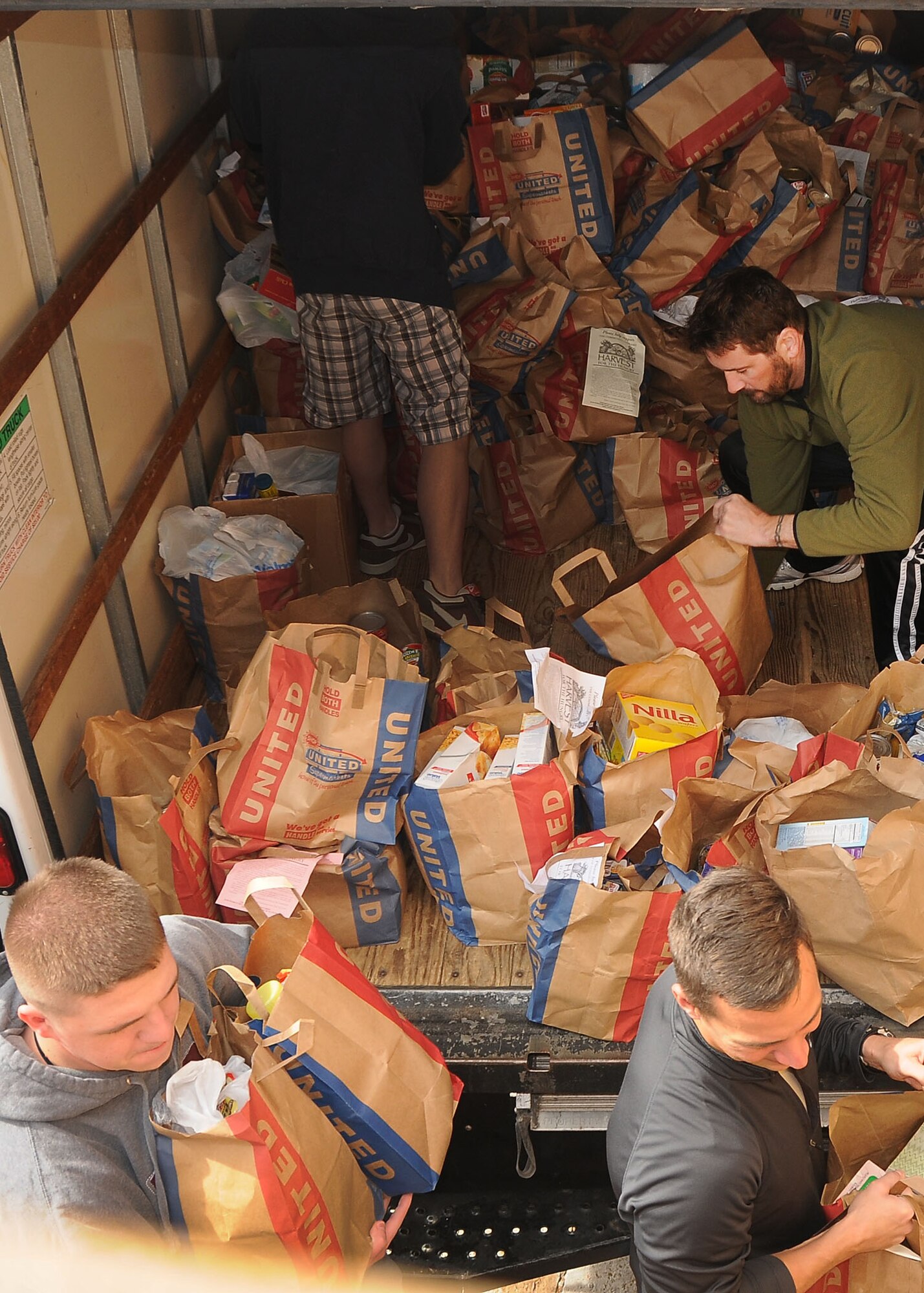ALTUS, Okla. – Members of the Altus community and Altus Air Force Base unload a truck at the S.G. Hove Center for the Harvest for the Hungry food drive Nov. 12, 2011. The campaign to collect food for the Community Cupboard ran from Nov. 5th to the 12th to assist those in need of food throughout the year. This year’s collection had an estimated 600 bags of non-perishable food items. (U.S. Air Force photo by Staff Sgt. Marianne E. Lane / 97th Air Mobility Wing Public Affairs-Released)