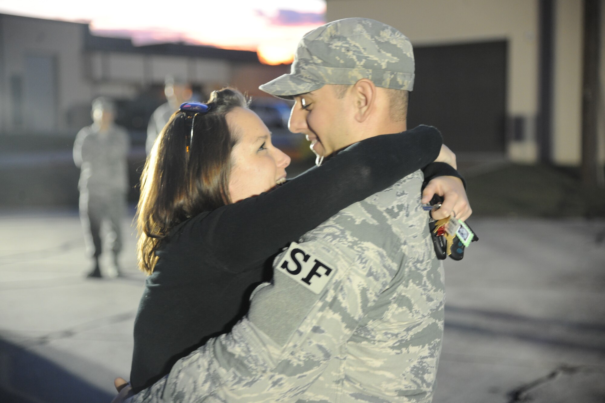 U.S Air Force Airman 1st Class Nicholas Koch, 822nd Base Defense Squadron fire team member, embraces his girlfriend at Moody Air Force Base, Ga., after returning from his deployment Nov. 12, 2011. Koch was part of a team which provided air base defense during a six-month deployment to Iraq. More than 50 Airmen returned to be greeted by their friends, family and coworkers. (U.S. Air Force photo by Airman 1st Class Paul Francis/Released)
