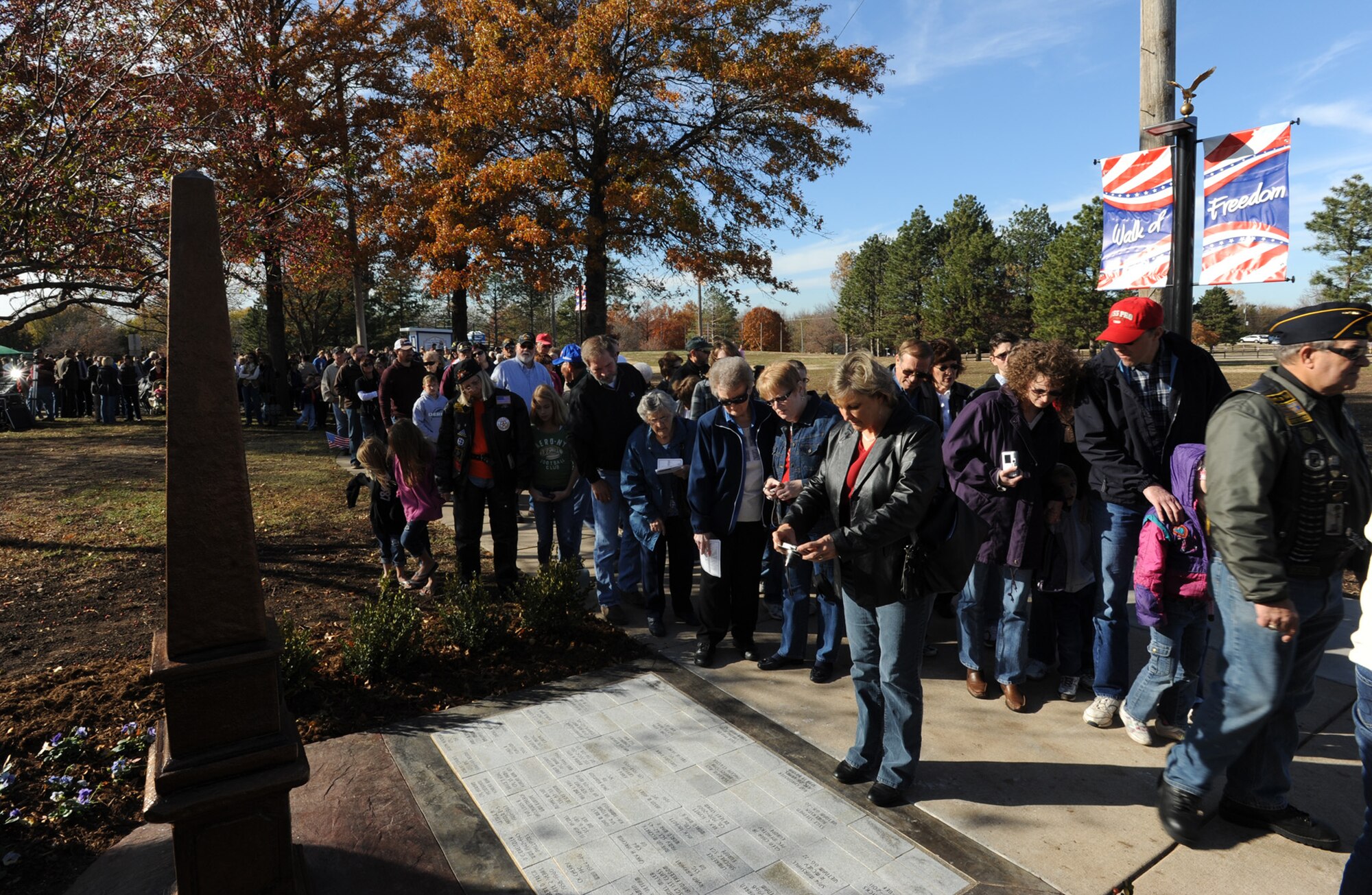 Community members and veterans gather and view memorials after a dedication ceremony of the Derby Area Veterans Memorial – Walk of Freedom at Garrett Park Nov. 11, 2011, Derby, Kan.  Planning and construction for the memorial began more than five years ago. (U.S. Air Force photo/ Airman 1st Class Laura L. Valentine)