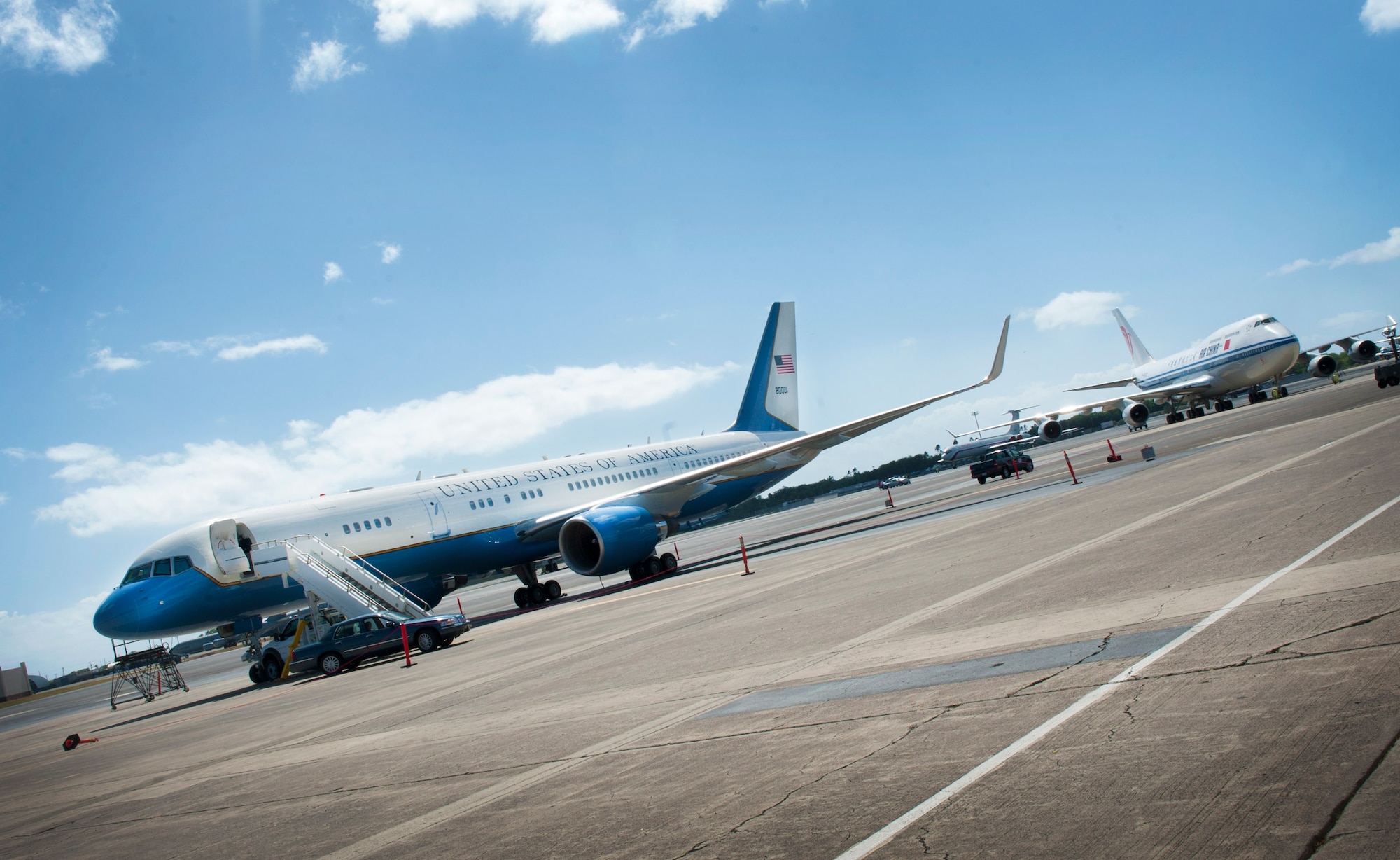 A Boeing 757, which flew Secretary of State Hilary Clinton to Hawaii, parks on the 15th Wing flightline, Joint Base Pearl Harobr-Hickam, during the Asia Pacific Economic Corporation conference Nov. 12. APEC is the premier economic forum in the Asia-Pacific region. Established in 1989 and comprising 21 member economies from around the Pacific Rim, including the U.S., APEC fosters growth and prosperity by facilitating economic cooperation and expanding trade and investment throughout the region. (U.S. Air Force photo/Senior Airman Lauren Main)
