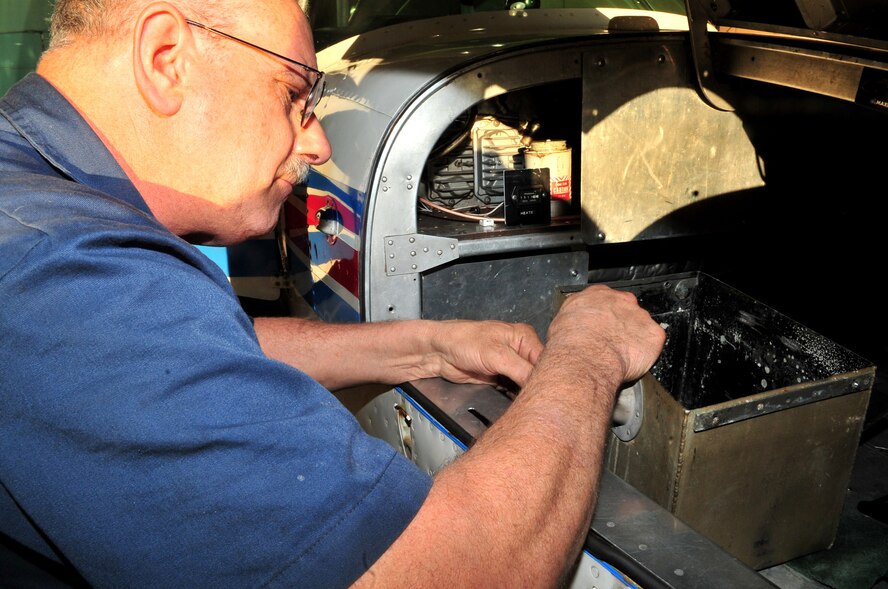 Chief mechanic Dean Williams of the Offutt Aero Club does repairs on a plane at the Offutt Aero Club. Mr. Williams is the only full time mechanic employed at the aero club.  (U.S. Air Force Photos by D.P. Heard)