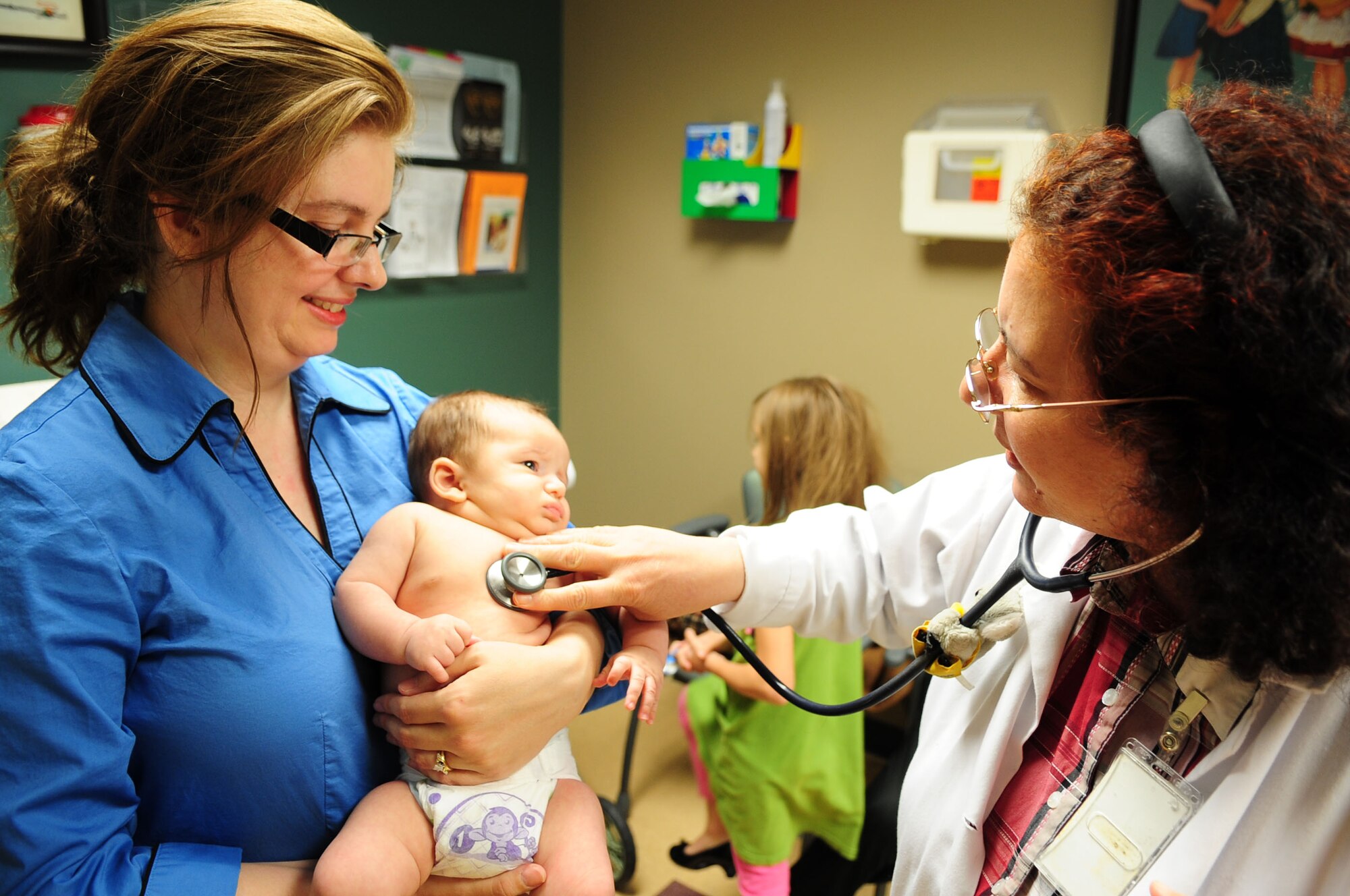 Caleb Rimsky, 2 months, son of Lt. Col. Mike and DaLonna Rimsky, 2nd Operational Support Squadron, is examined by Dr. Badia Azzawe, 2nd Medical Group, during a pediatric examination at the clinic on Barksdale Air Force Base, La., Nov 3. Regular pediatric examinations help ensure the proper development of children. (U.S. Air Force photo/2nd Lt. Victoria Lalich)(RELEASED)