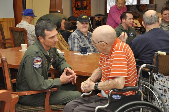 477th Fighter Group commander spoke with a Alaska Veterans and Pioneers Home resident  in Palmer, Alaska Nov. 11.