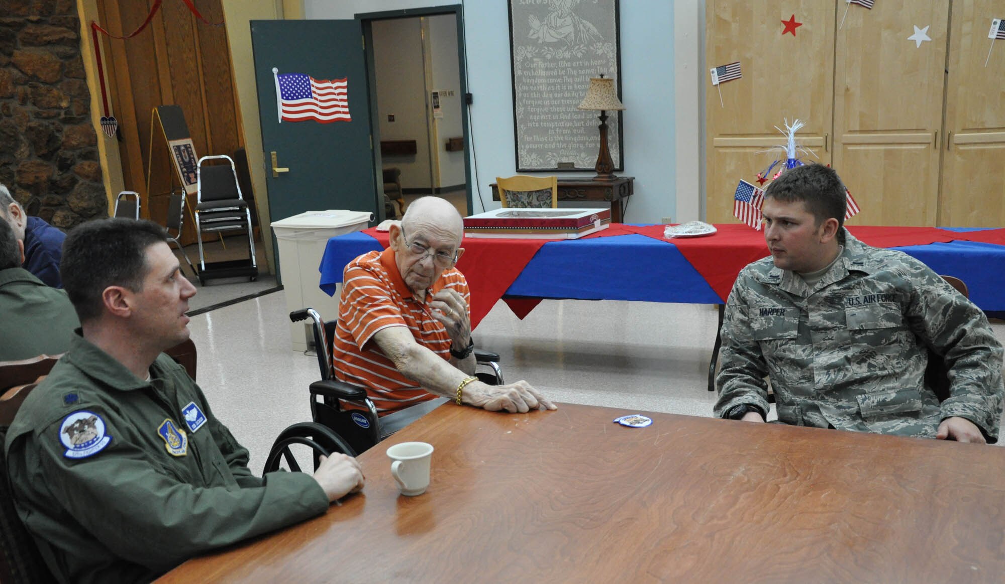 Lt. Col. Rob Jackson and 1st Lt. Mark Harper spoke with a Alaska Veterans and Pioneers Home resident in Palmer, Alaska Nov. 11, 2014.