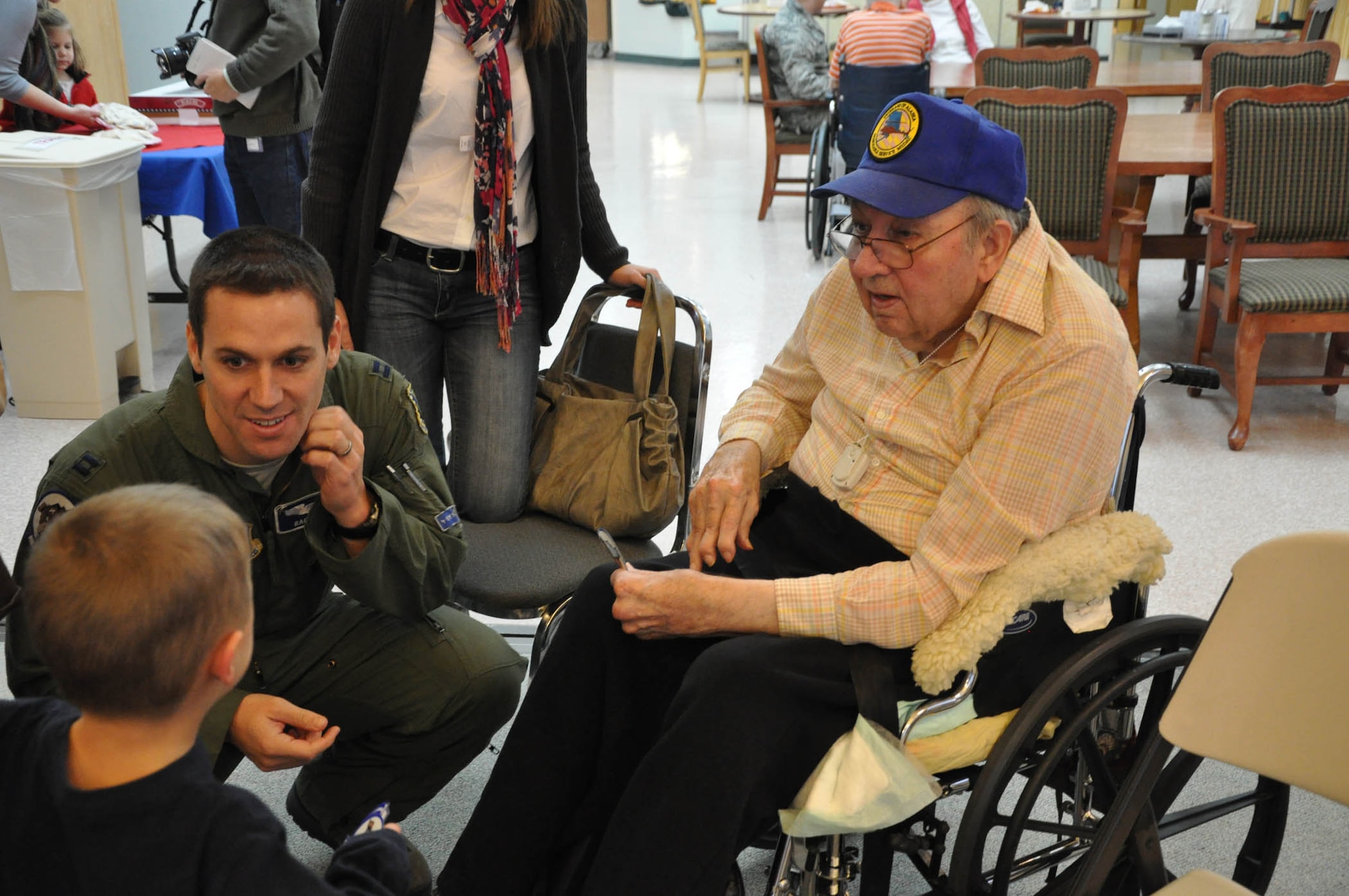 Capt. Eric Otto spoke with a resident of Alaska Veterans and Pioneers Home in Palmer, Alaska Nov. 11, 2011.