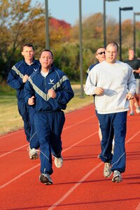 U.S. Air Force Airmen from the 633rd Air Base Wing Legal Office wear cold weather physical training attire while participating in unit pt at Langley Air Force Base, Va., Nov. 14, 2011. Airmen should be aware of the weather, including wind chill and temperatures that will affect surface conditions; this is an easy way to avoid wind burn, difficulty breathing, or slipping on snowy or icy surfaces. (U.S. Air Force photo by Airman 1st Class Kayla Newman/Released)
