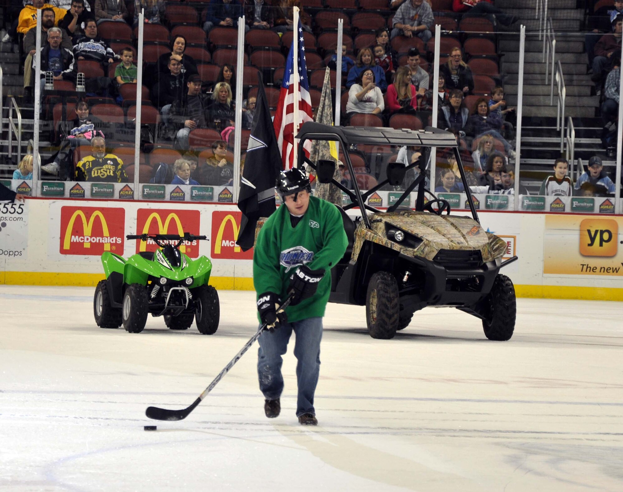 Staff Sgt. Erron Hogue, a hydraulics systems technician with the 931st Air Refueling Group Aircraft Maintenance Squaderon, participates in the "Dress Like a Pro" competition during the intermission of a Wichita Thunder hockey game, Nov. 11, 2011.  The competition was part of the Thunder's Veterans Day game, during which several McConnell Airmen were honored for their service.  (U.S. Air Force photo by 1st Lt. Zach Anderson)