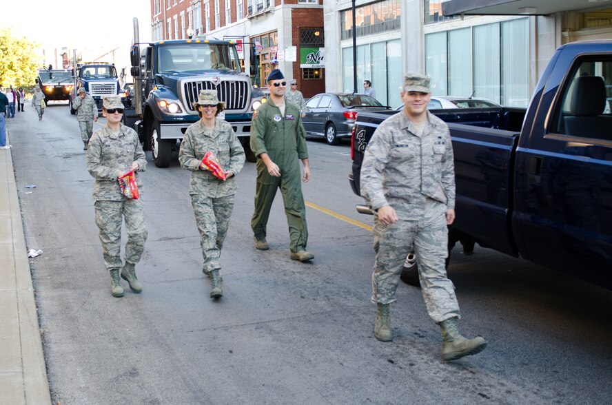 Members of the 139th Airlift Wing, Missouri Air National Guard, parade down the streets of St. Joseph, Mo., on Veteran’s Day Nov. 11, 2011. Members waved and handed out candy as they walked in the parade. (U.S. Air Force photo by Staff Sgt. Michael Crane/Missouri Air National Guard)