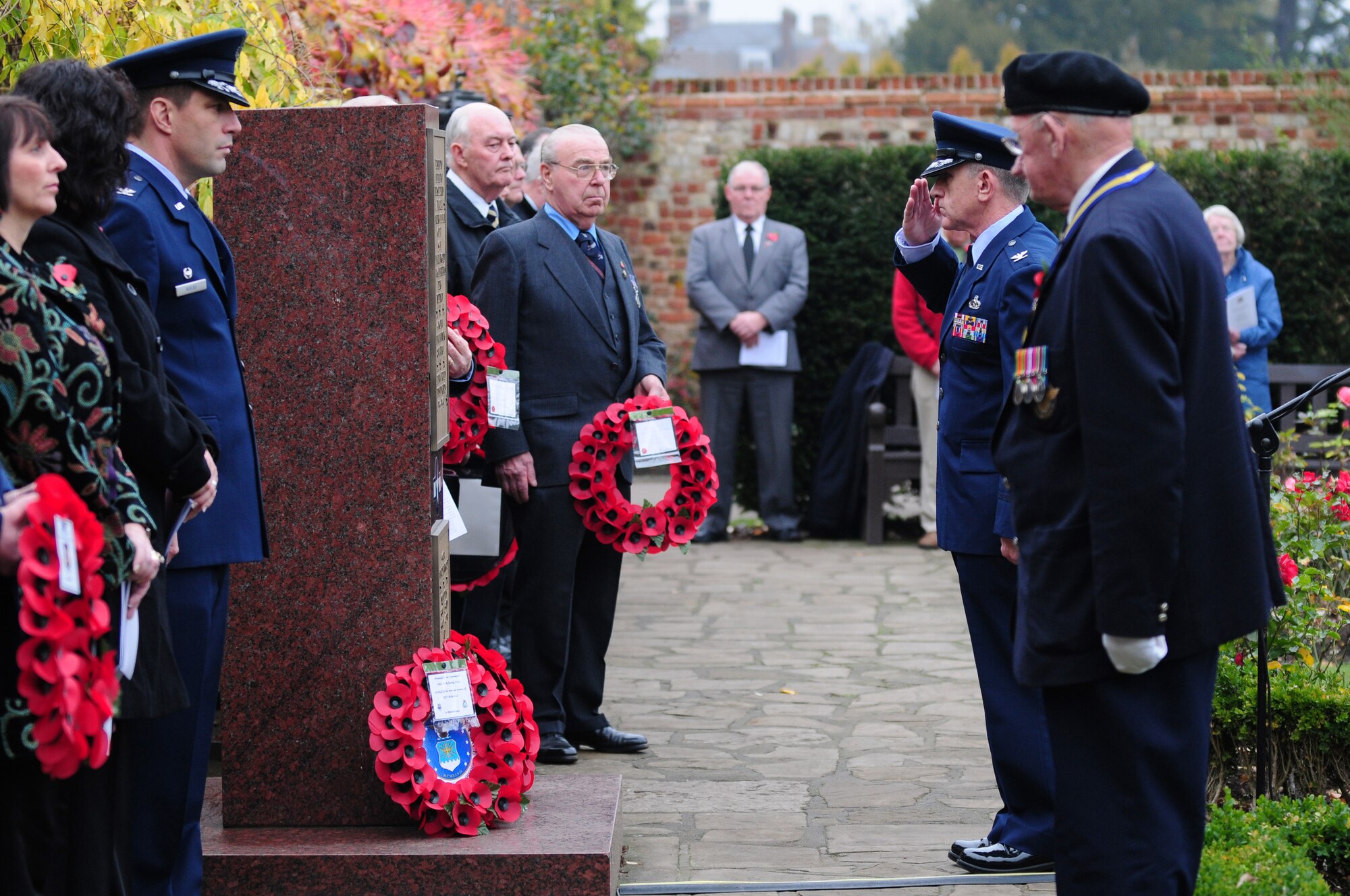 BURY ST. EDMUNDS, England - Col. Matthew Cox, 48th Maintenance Group commander, salutes the 94th Bombardment Group Memorial after laying a wreath for Remembrance Day, Nov. 12, 2011. The annual ceremony is held in honor of those who have made the ultimate sacrifice. (U.S. Air Force photo by Senior Airman Lausanne Morgan)