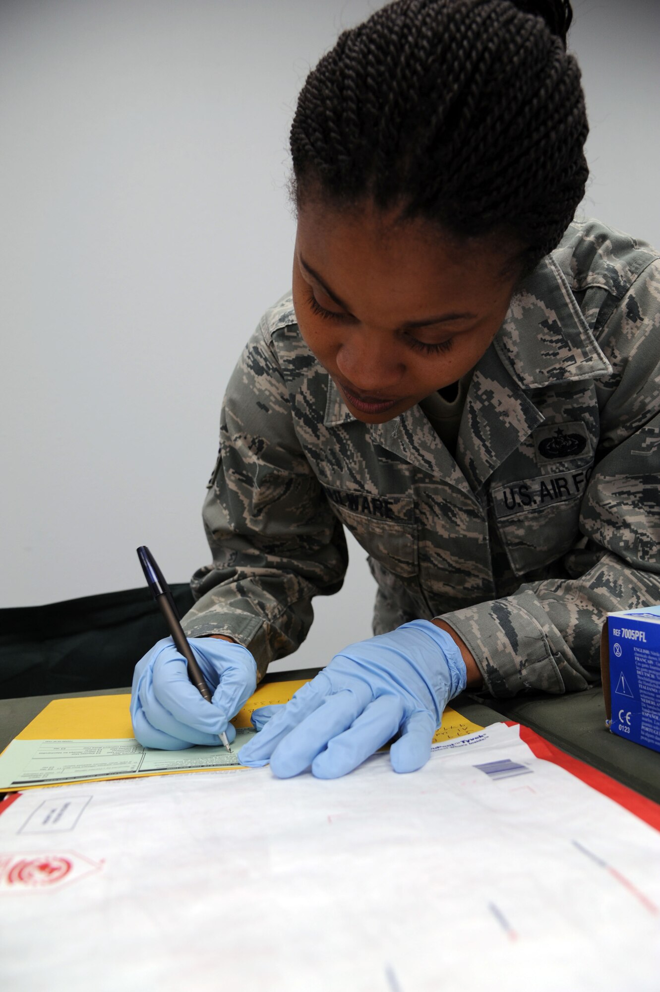 Tech. Sgt. Roxanne Boulware, 19th Communications Squadron non-commissioned officer in charge of base knowledge operations management, prepares to mail a registered document Nov 7, 2011, at Little Rock Air Force Base, Ark. Boulware was one of three airmen chosen to develop an Air Force wide SharePoint Job Qualification Standard, the first Air Force level training program for SharePoint site creation. (U.S. Air Force photo by Airman 1st Class Kaylee Clark)