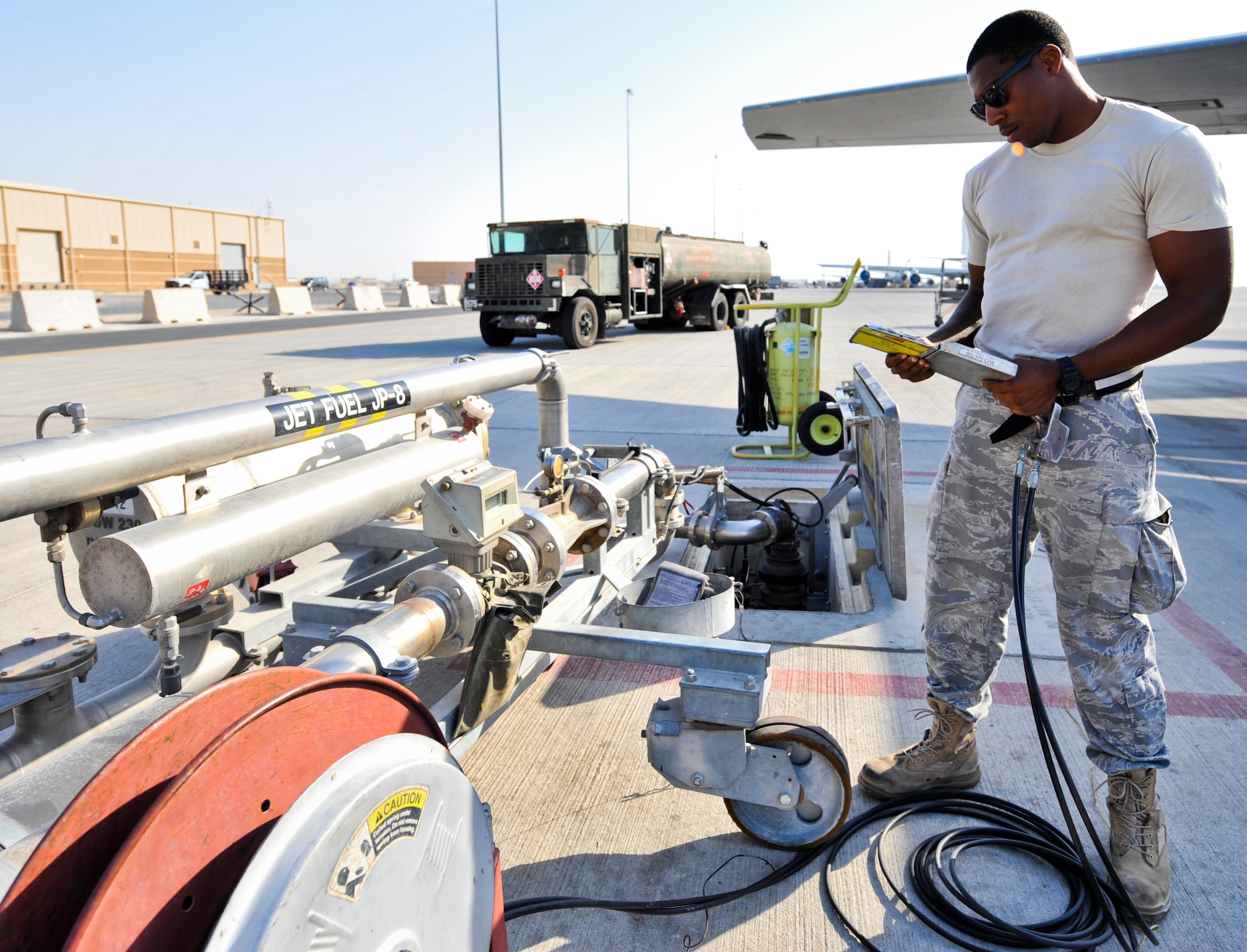 Senior Airman Marcus Holden, 379th Expeditionary Logistics Readiness Squadron fuel distribution operator,  goes through his checklist while refueling his R-11 truck before heading out to refuel an aircraft Oct. 23, 2011, at an undisclosed location in Southwest Asia. Holden, a native of Fort Valley, Ga., is deployed from Joint Base McGuire-Dix-Lakehurst, N.J. (U.S. Air Force photo/Senior Airman Paul Labbe)