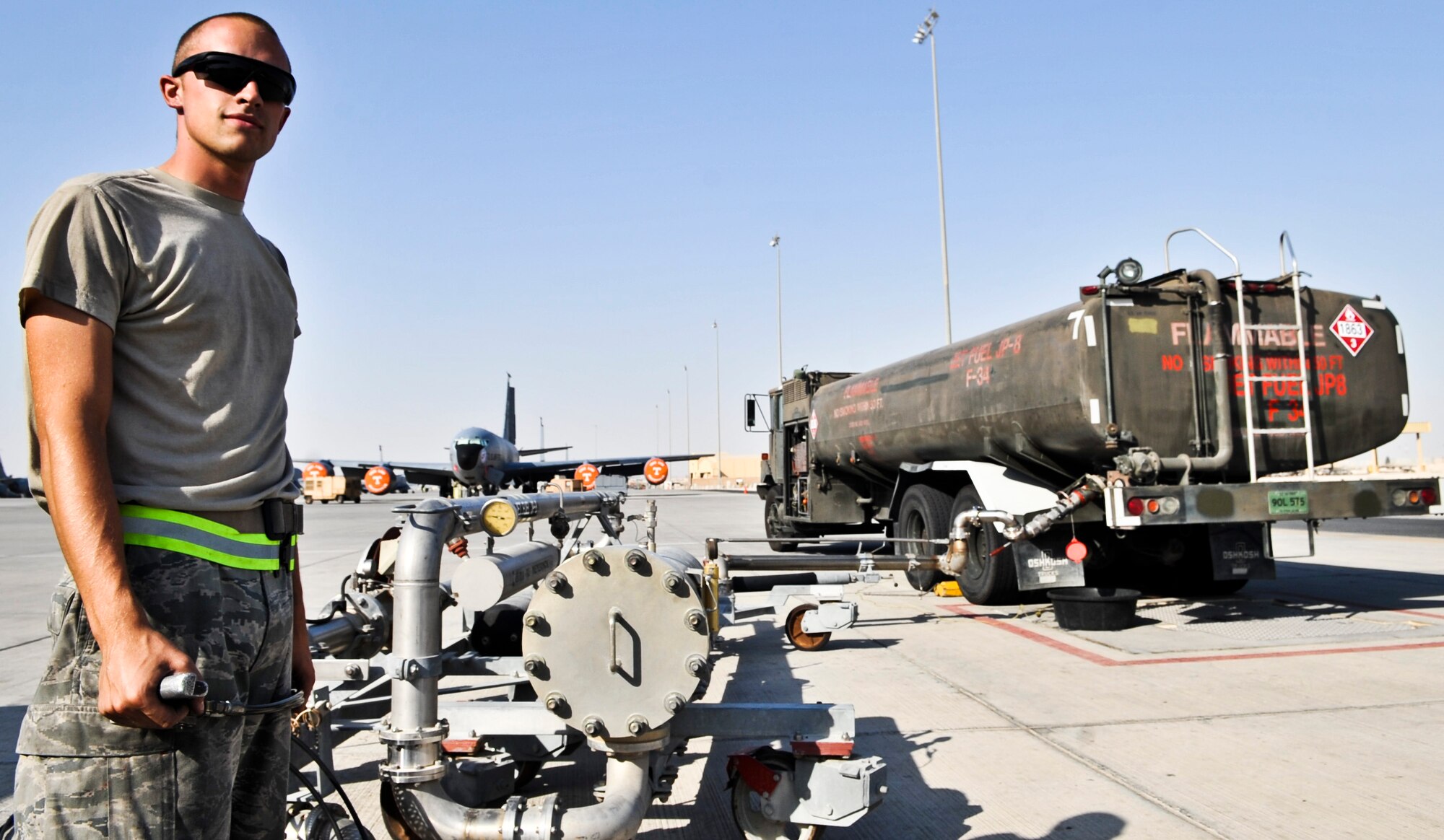 Senior Airman Bryan Winterstein, 379th Expeditionary Logistics Readiness Squadron fuel distribution operator, fills his R-11 truck before heading out to refuel an aircraft Oct. 23, 2011, at an undisclosed location in Southwest Asia. The R-11 holds 6,000 gallons and can pump about 600 gallons a minute. Winterstein, a native of Joliet, Ill., is deployed from Scott Air Force Base, Ill. (U.S. Air Force photo/Senior Airman Paul Labbe)
