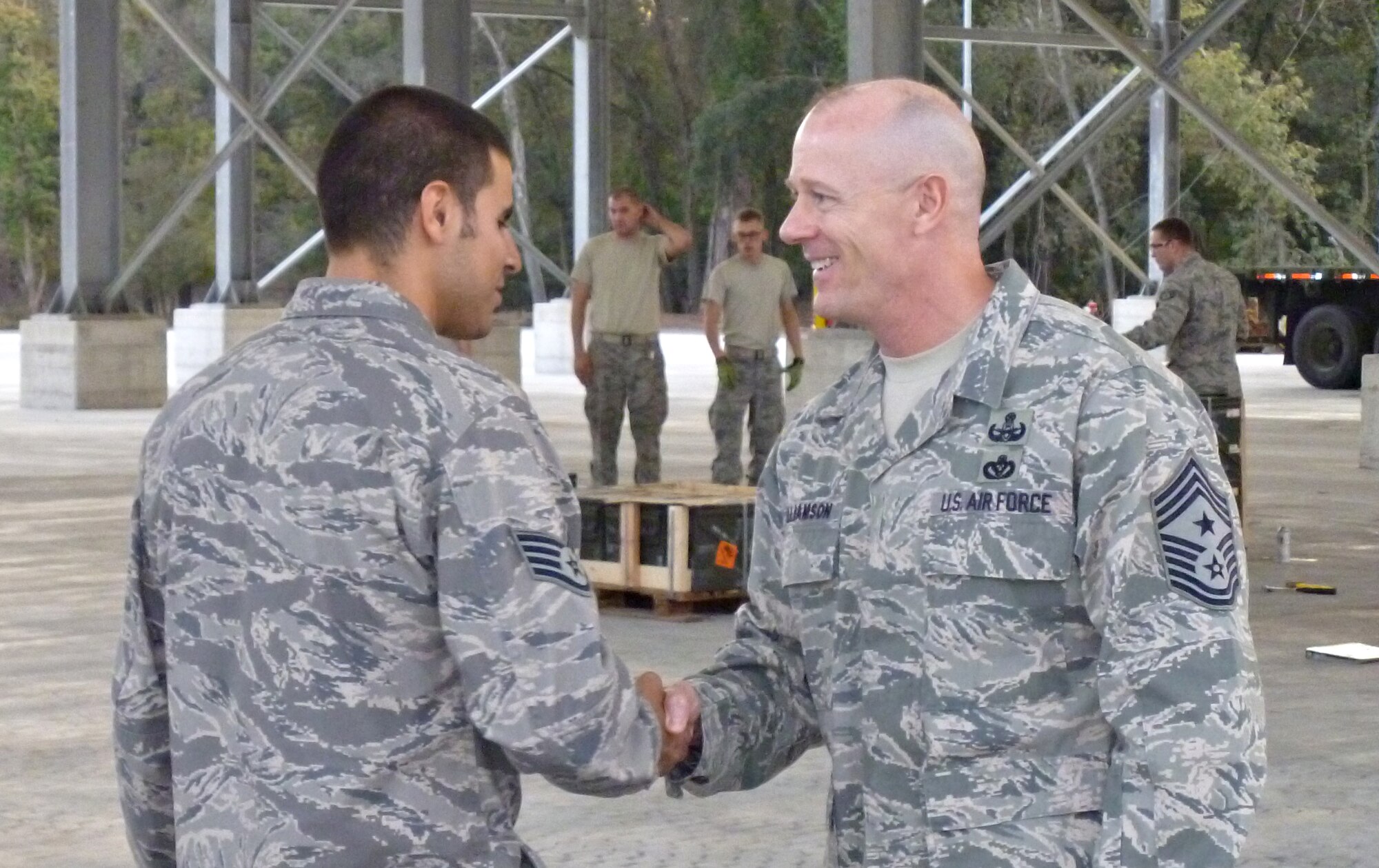 U.S. Air Forces in Europe’s Command Chief Master Sgt. David Williamson (right) meets with Staff Sgt. Johnny Escobar, 731st Munitions Squadron precision guided maintenance crew chief, during a command visit to Camp Darby, Italy, Nov. 2, 2011.  The visit was part of Chief Williamson’s two-country, three-day trip to geographically-separated units (GSUs) in USAFE.  In addition to the 731st MUNS, Chief Williamson visited the 704th MUNS at Ghedi Air Base, Italy, and the 425th Air Base Squadron at Izmir, Turkey. (U.S. Air Force photo by Staff Sgt. Kalob Hinners)