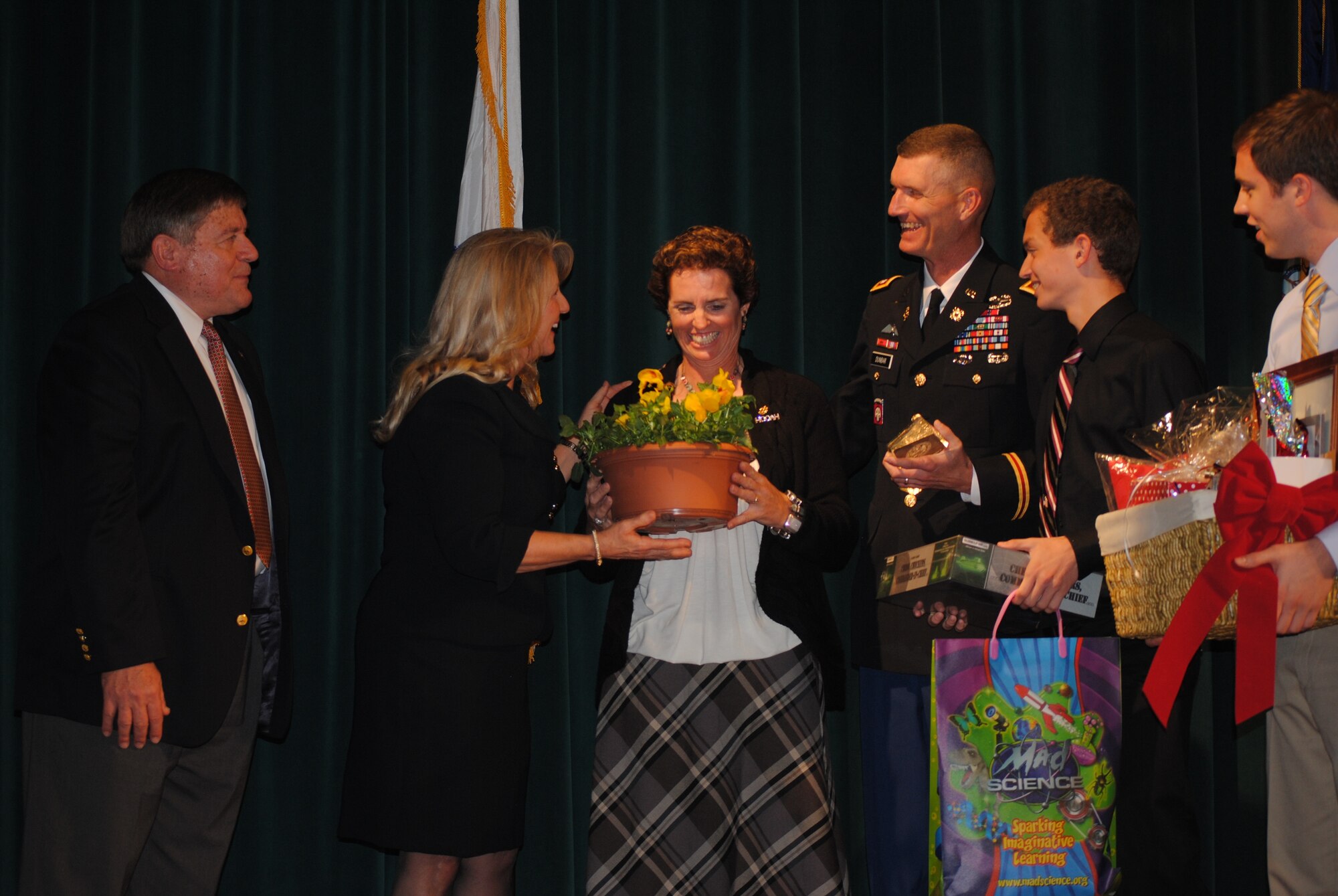 The family of Lt. Col. Layton Dunbar, commander, 24th Transportation Battalion, 7th Sustainment Brigade, was recently nominated the Army Five Star Military Family for their hard work and volunteerism. Pictured from left at the Murray Center in Norfolk Nov. 4 is retired Capt. Robert A. Duetsch, executive director, Hampton Roads ASYMCA, Maureen McDonnell, First Lady of Virginia, Kate Dunbar, Lt. Col. Layton Dunbar, and their children Sean and Andrew Dunbar.