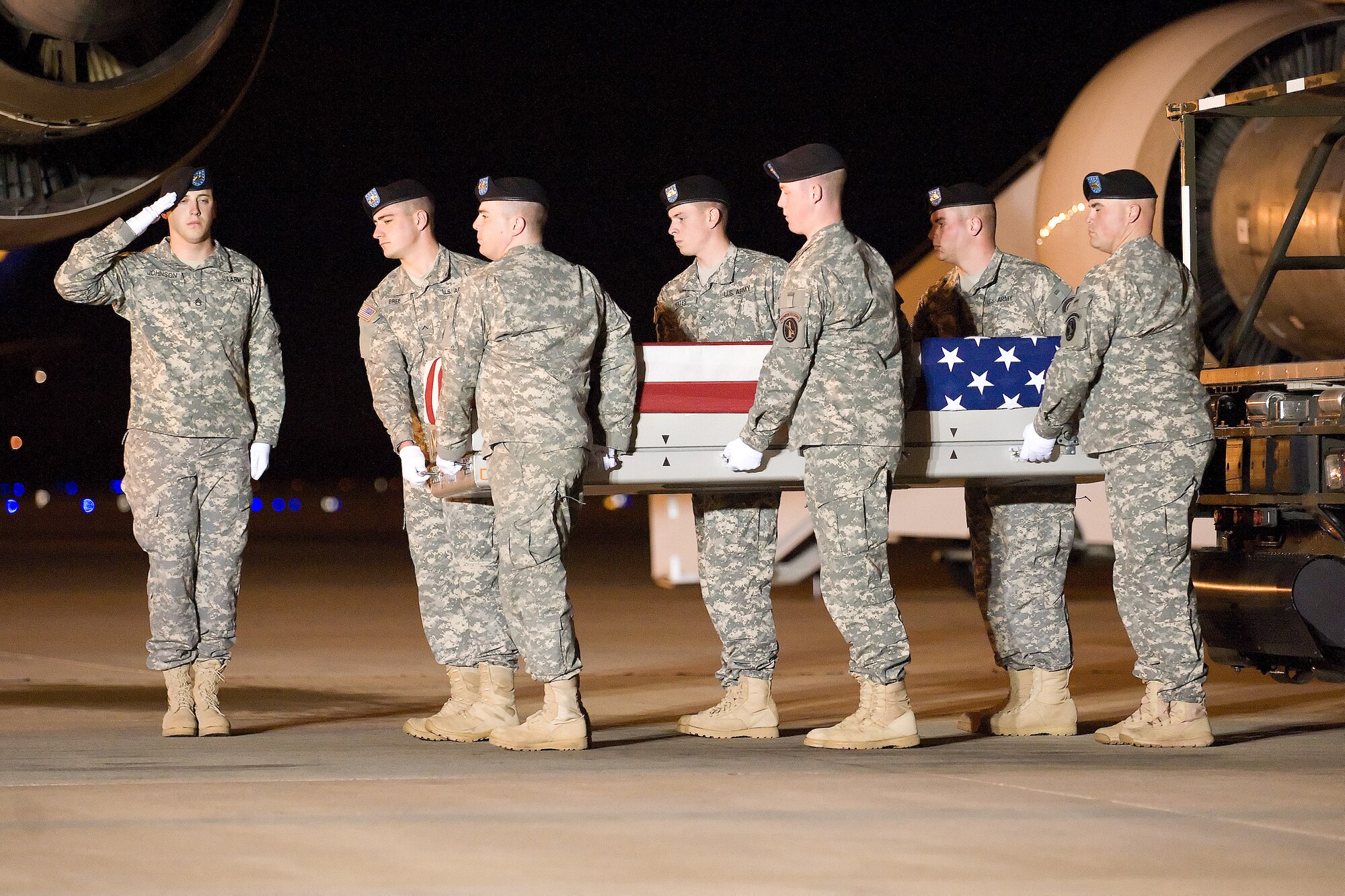 A U.S. Army carry team transfers the remains of Army Spc. Calvin M. Pereda of Fayetteville, N.C., at Dover Air Force Base, Del., Nov. 13, 2011. Pereda was assigned to the 1st Battalion, 5th Infantry Regiment, 1st Stryker Brigade Combat Team, 25th Infantry Division, Fort Wainwright, Alaska. (U.S. Air Force photo/Adrian R. Rowan)
