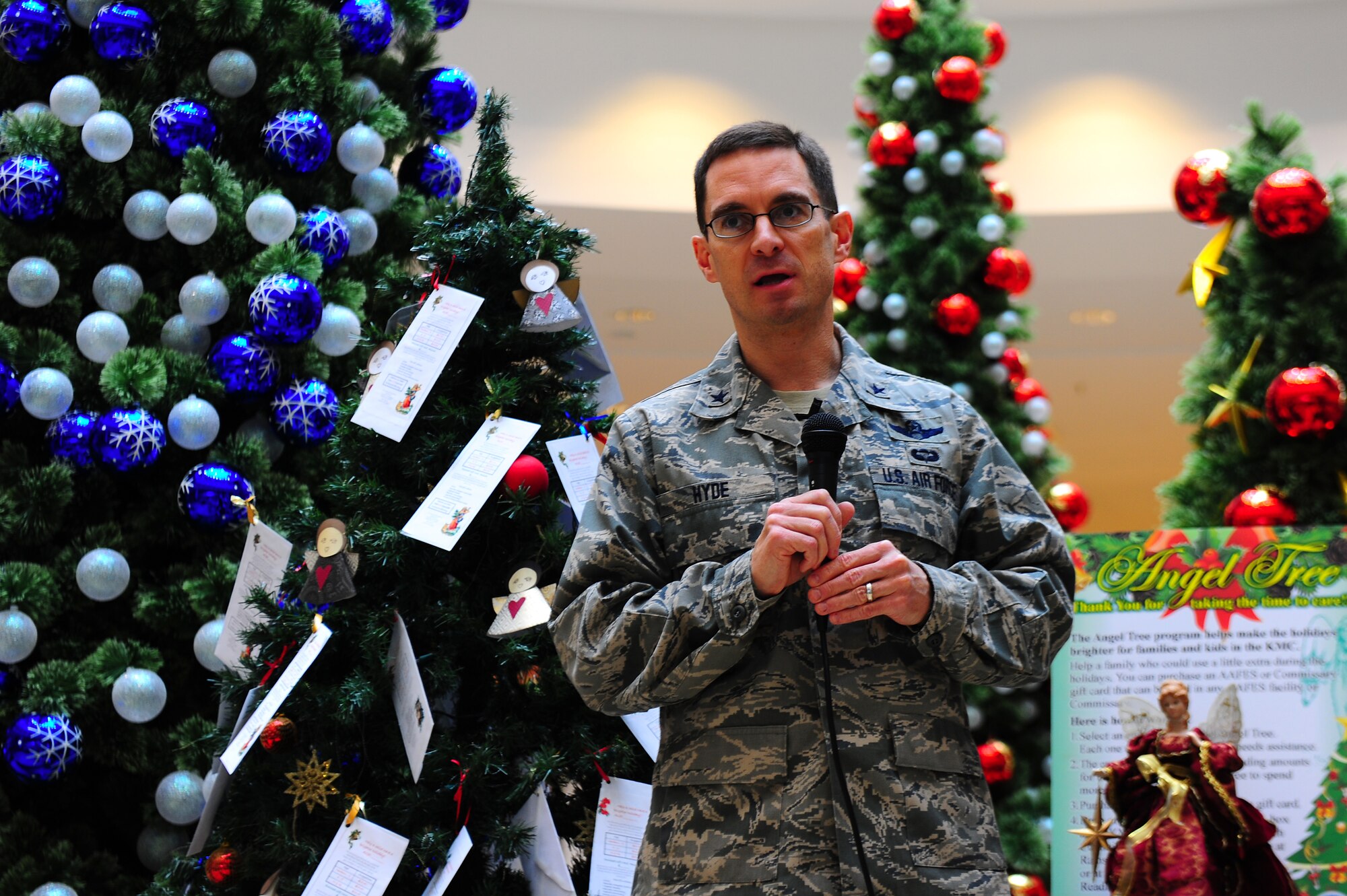 Air Force Brig. Gen. C.K. Hyde, 86th Airlift Wing commander, addresses the crowd during the opening ceremony of the Angel Tree program at the KMCC, Ramstein Air Base, Germany, Nov. 10, 2011. The program provides assistance to Air Force families in the KMC who need financial assistance with the purchase of gifts for their childern during the holiday season. (U.S. Air Force photo by Airman Brea Miller)