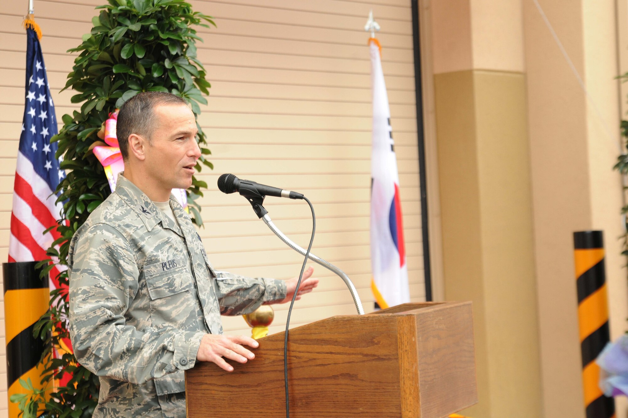 Col. Scott Pleus, 8th Fighter Wing commander, speaks during the ribbon cutting ceremony for the opening of a new maintenance complex at Kunsan Air Base, Republic of Korea, Nov. 9. The ceremony signifies the end of construction for the new Maintenance Complex Phases 1 and 3. (U.S. Air Force photo by Senior Airman Brittany Y. Auld/Released)